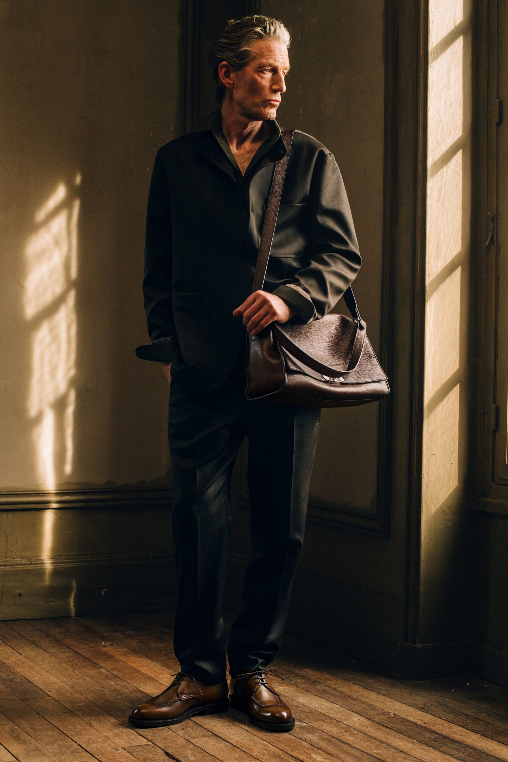 black tailored suit with brown shoes