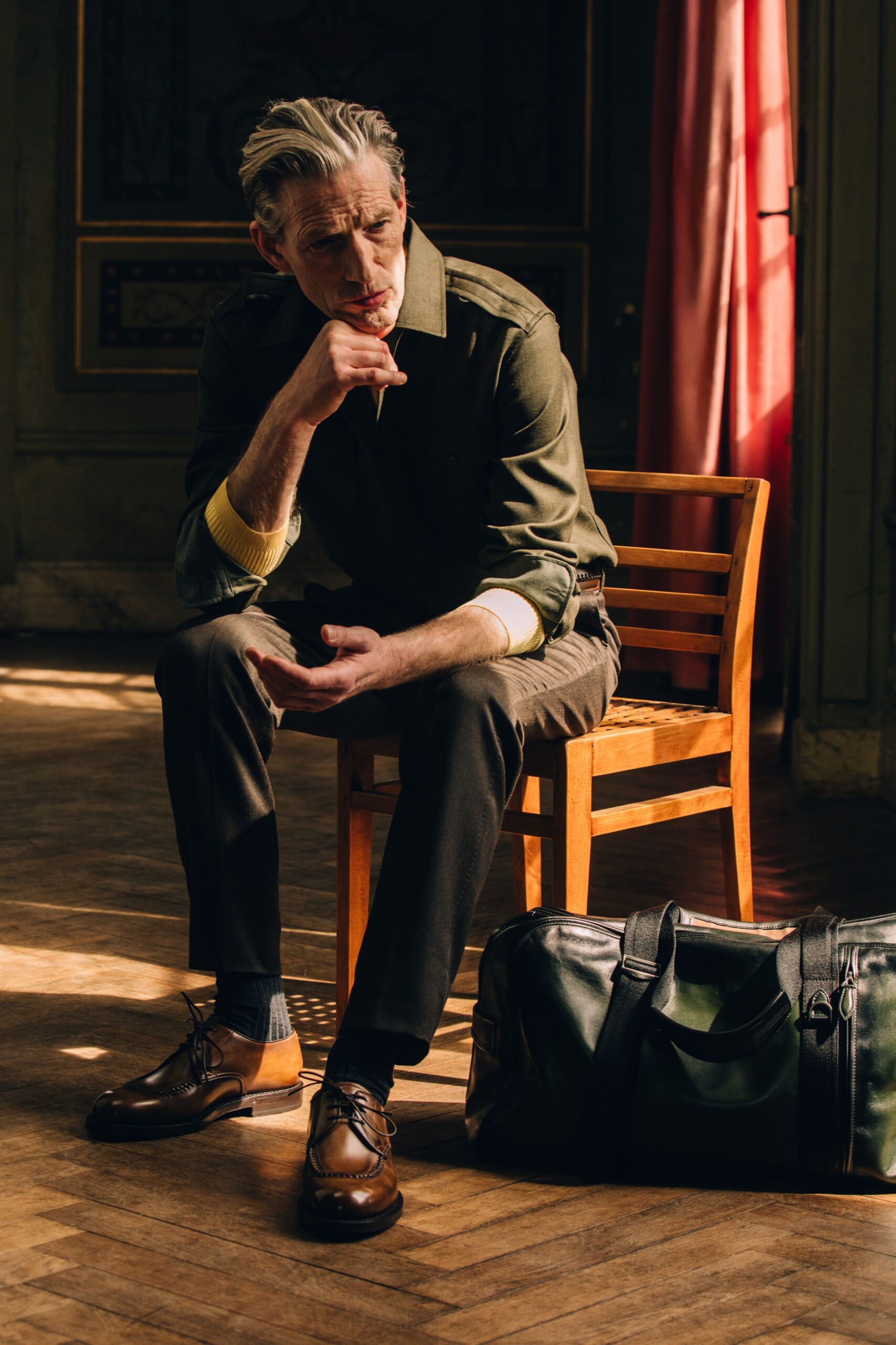 green shirt black pants brown shoes