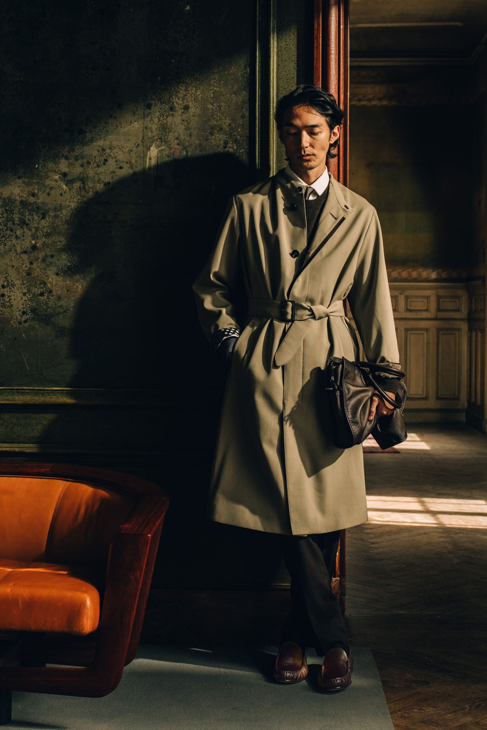 beige trench coat with black pants