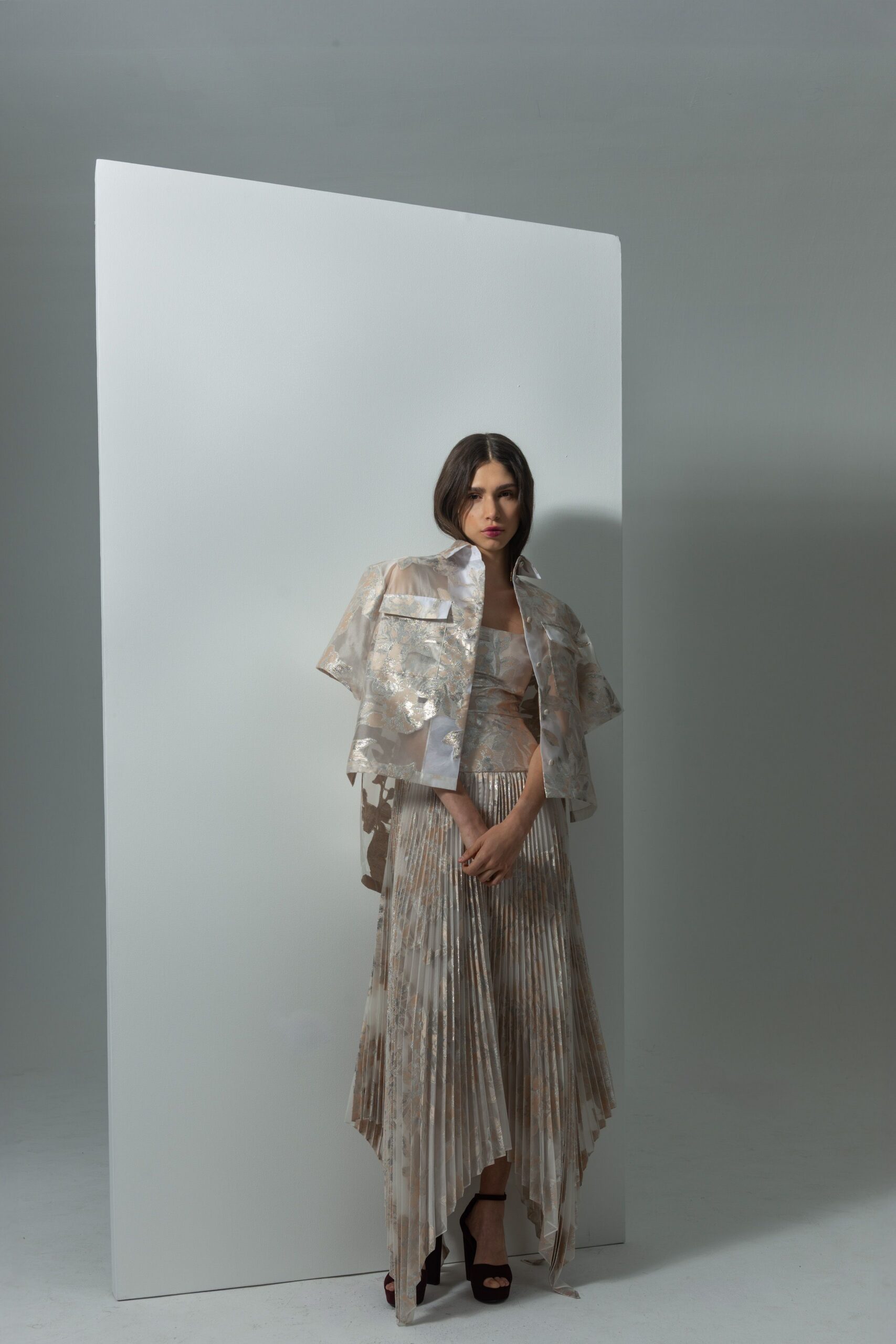 beige silk fitted pleated flowing midi skirt
