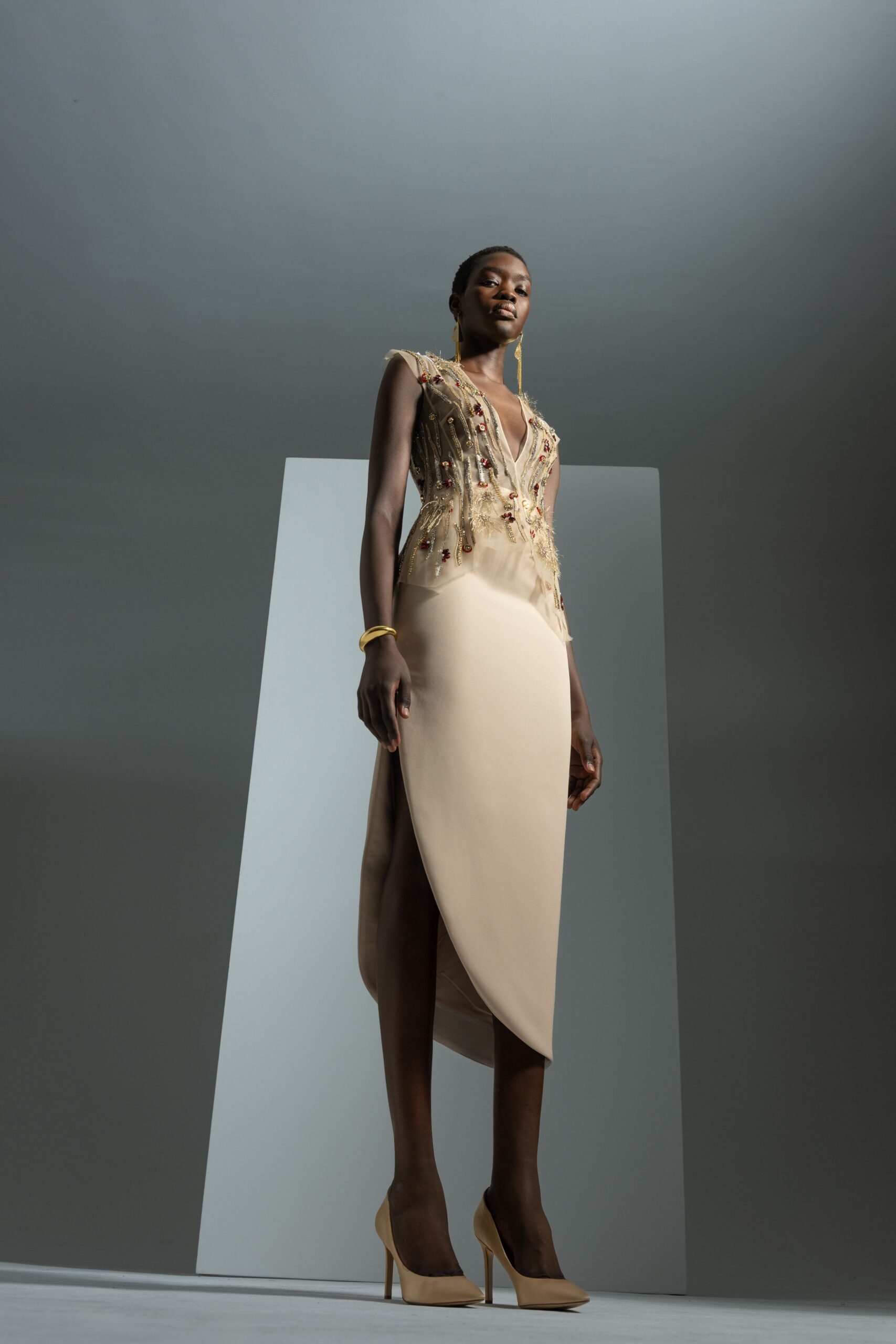beige silk sleeveless v-neck fitted embroidered draped gown