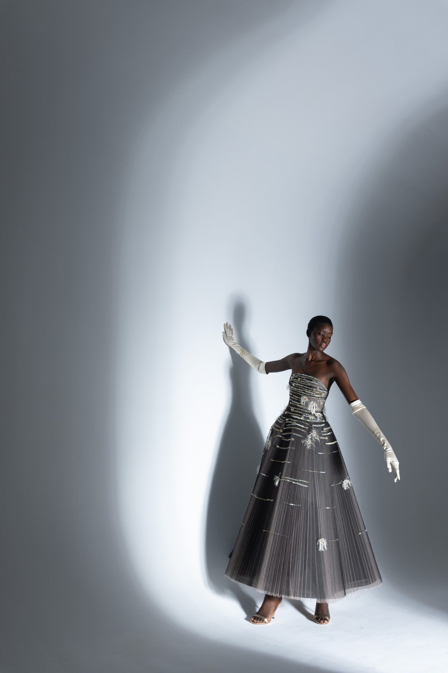gray silk strapless fitted pleated embroidered flowing gown