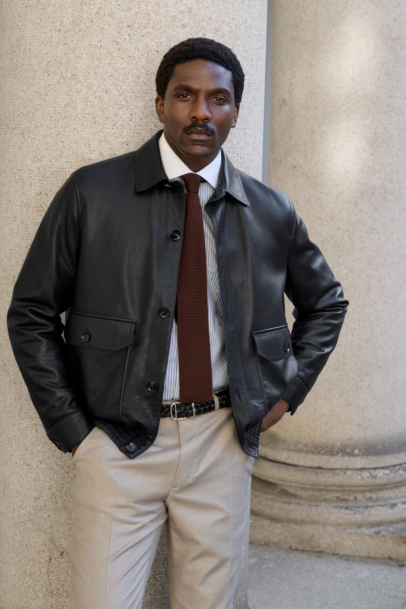 black leather long-sleeve collared fitted buttoned jacket