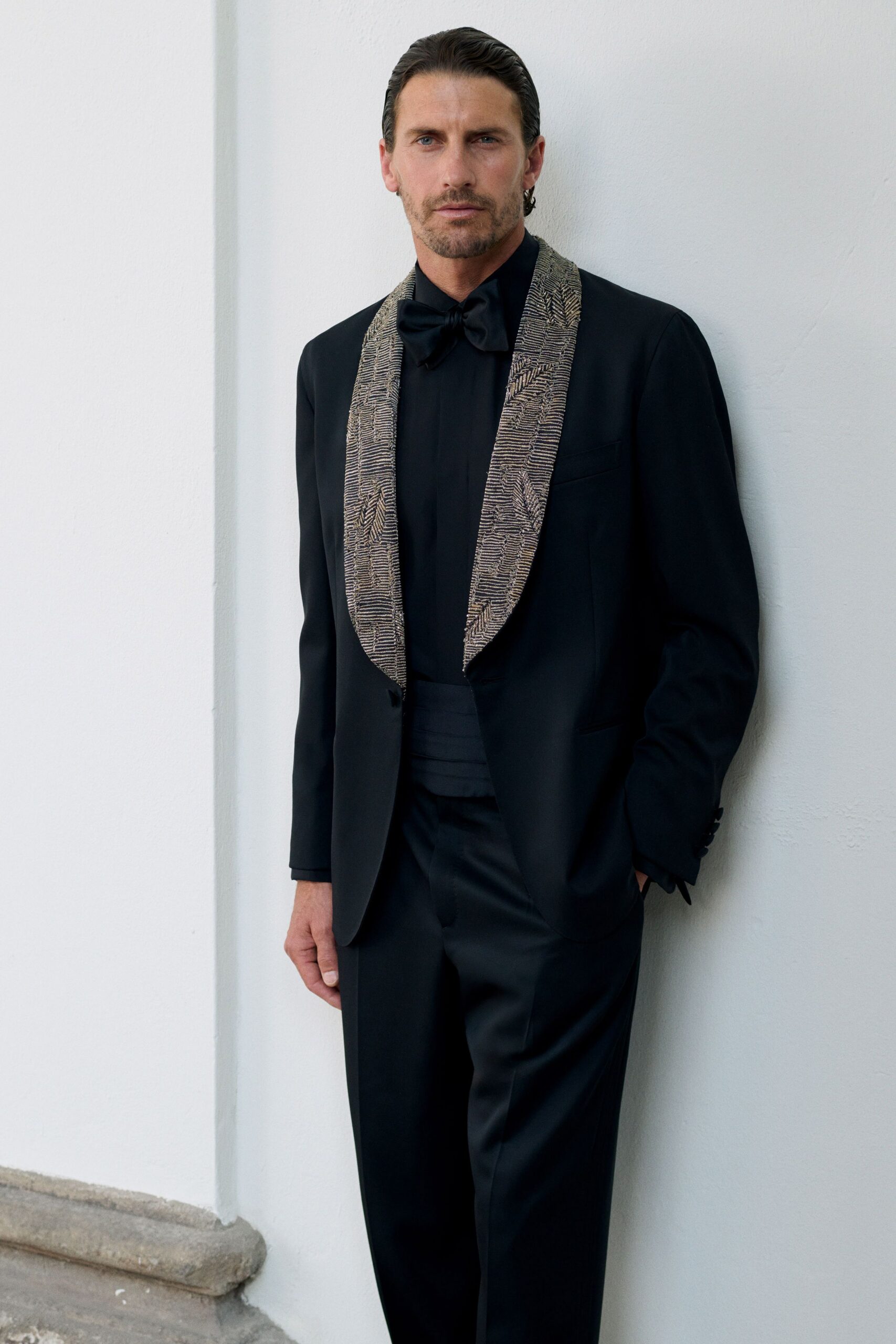 black tailored suit with bow tie