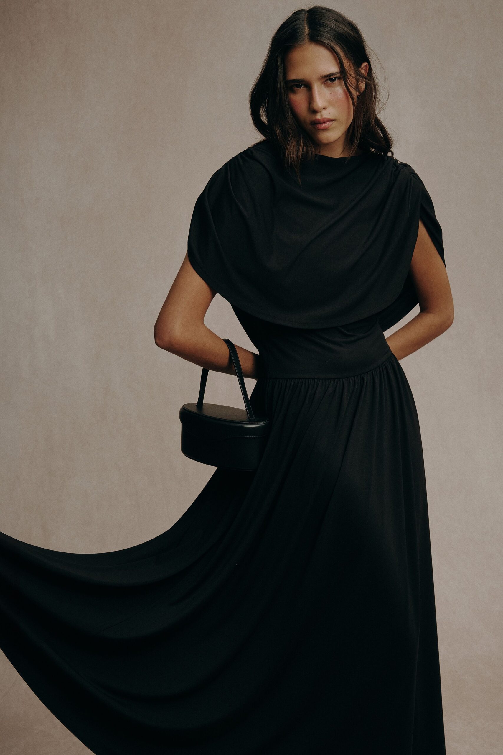 black cotton sleeveless high-neck fitted draped flowing dress