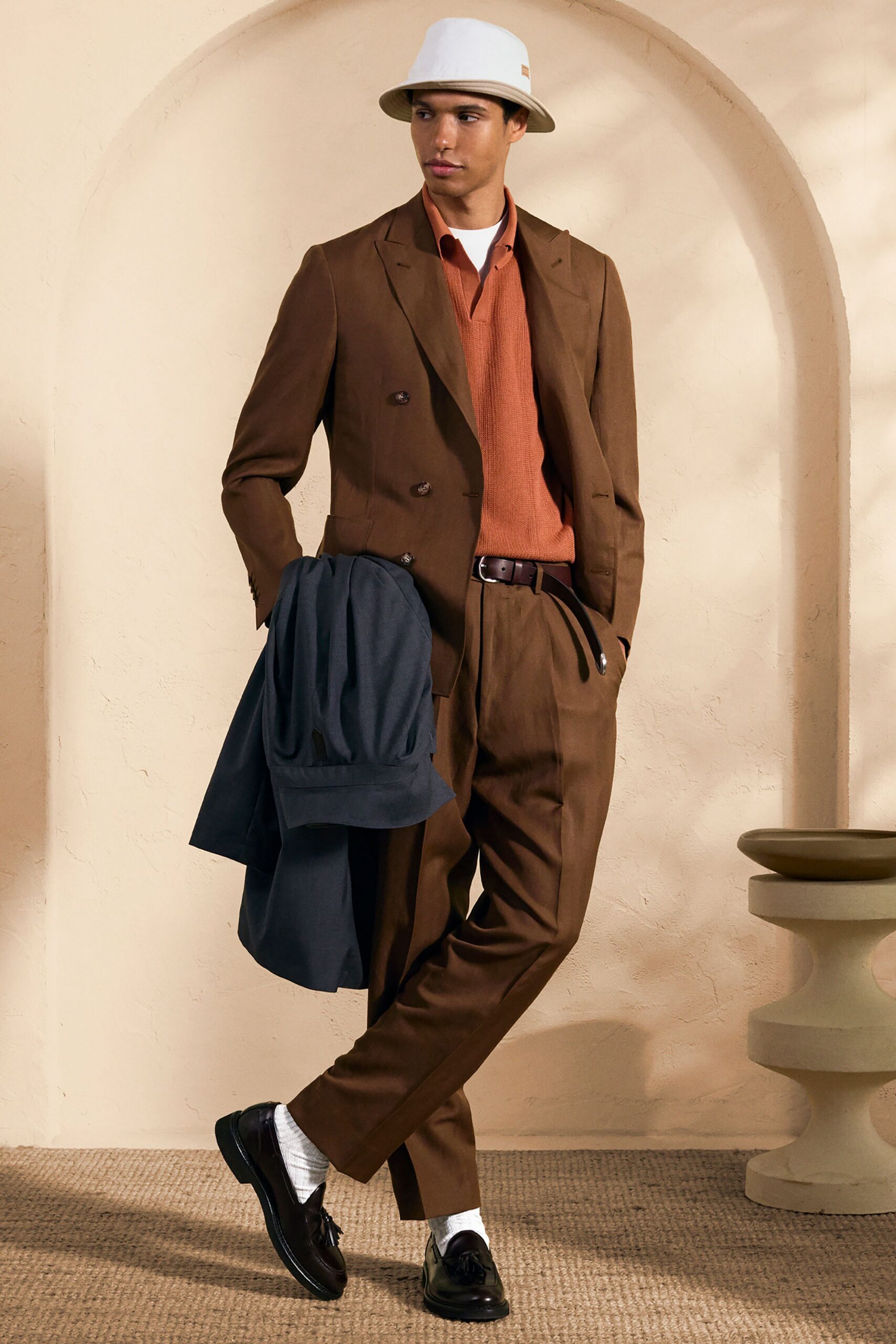 brown long-sleeve collared tailored suit