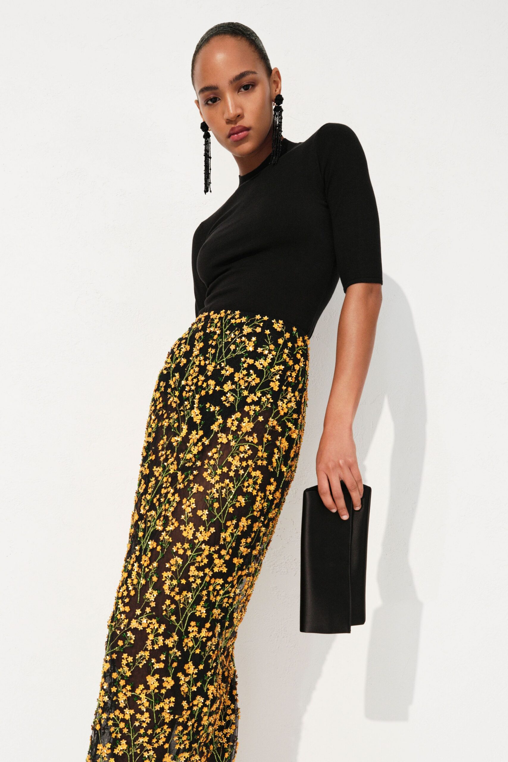 black fitted top with floral skirt
