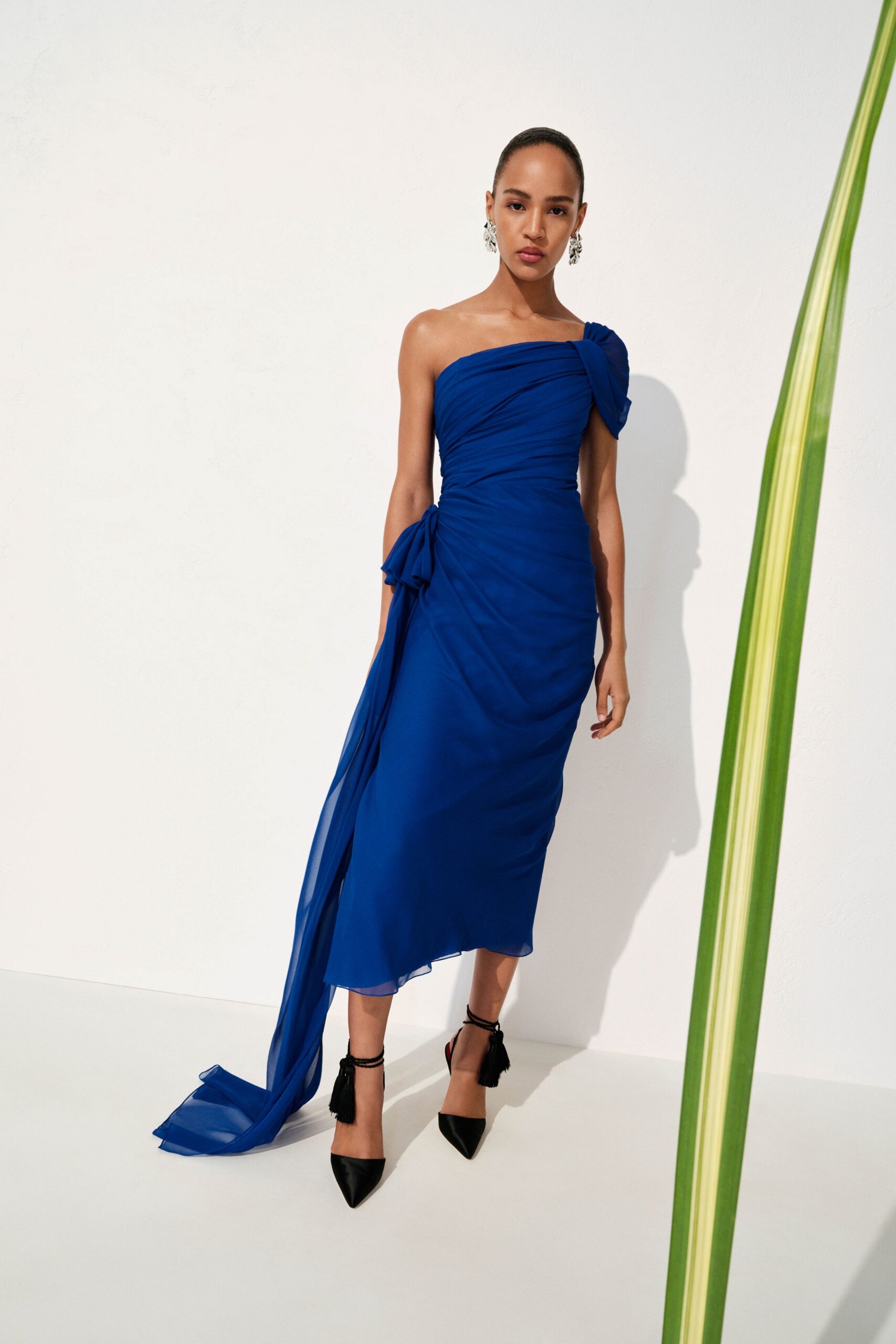 blue silk strapless asymmetric fitted ruched flowing gown