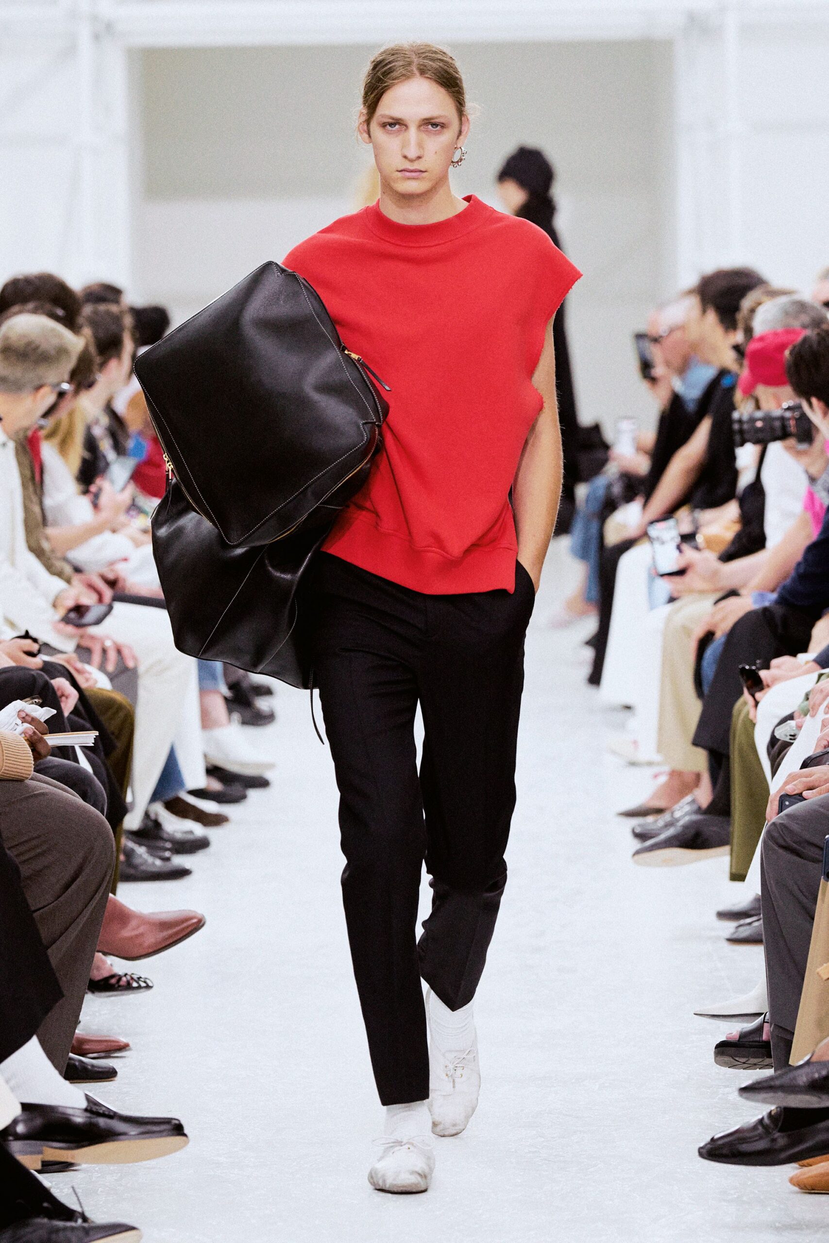 red sleeveless top with black pants