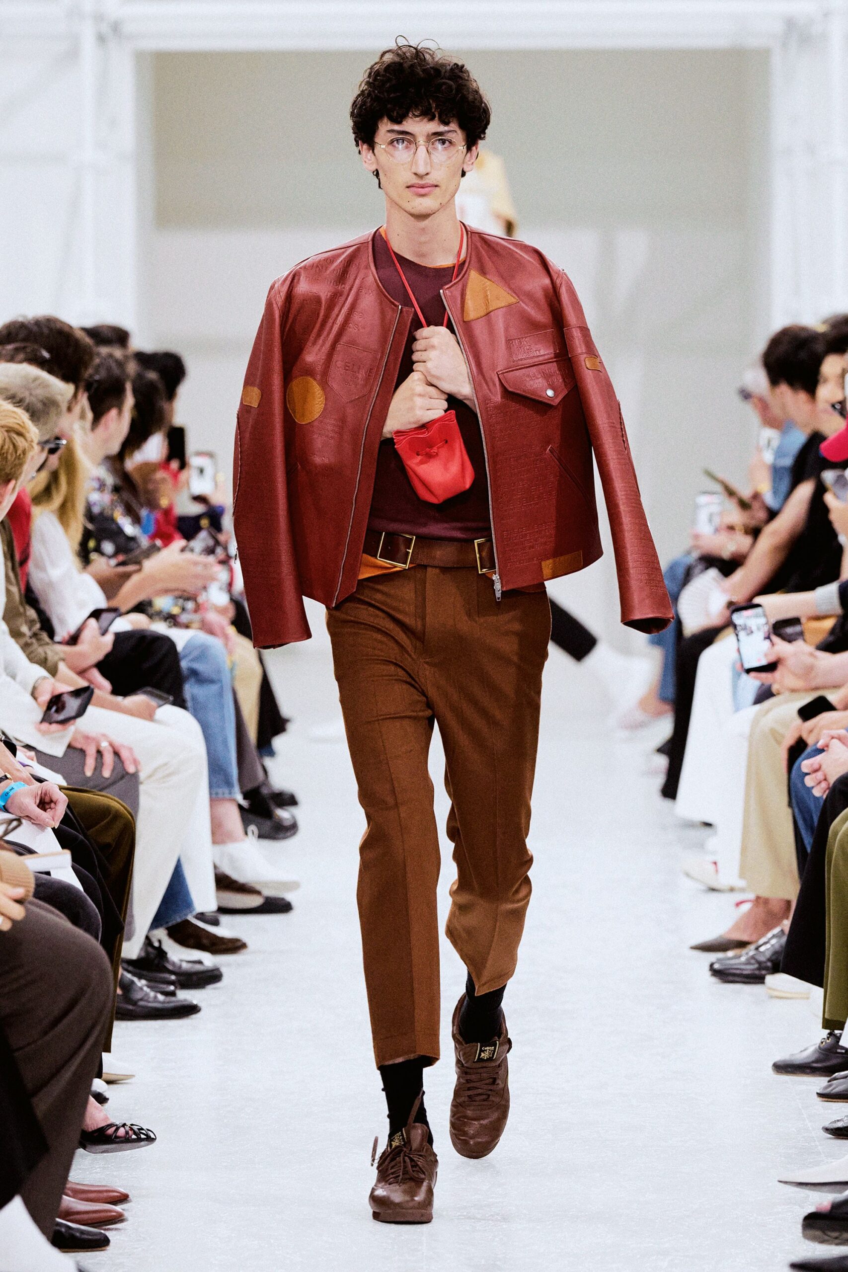 red leather jacket with brown pants