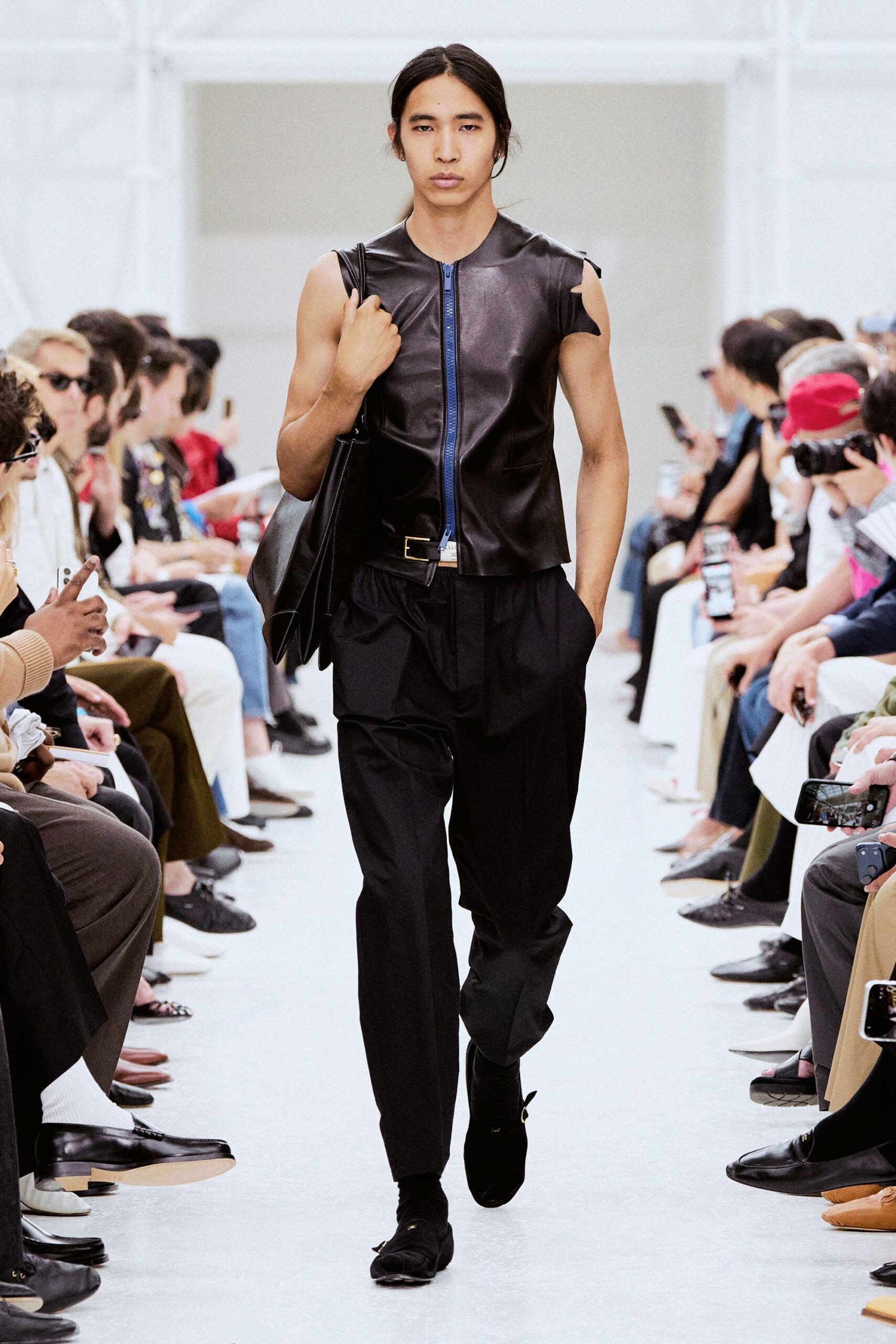 black leather sleeveless top with relaxed pants