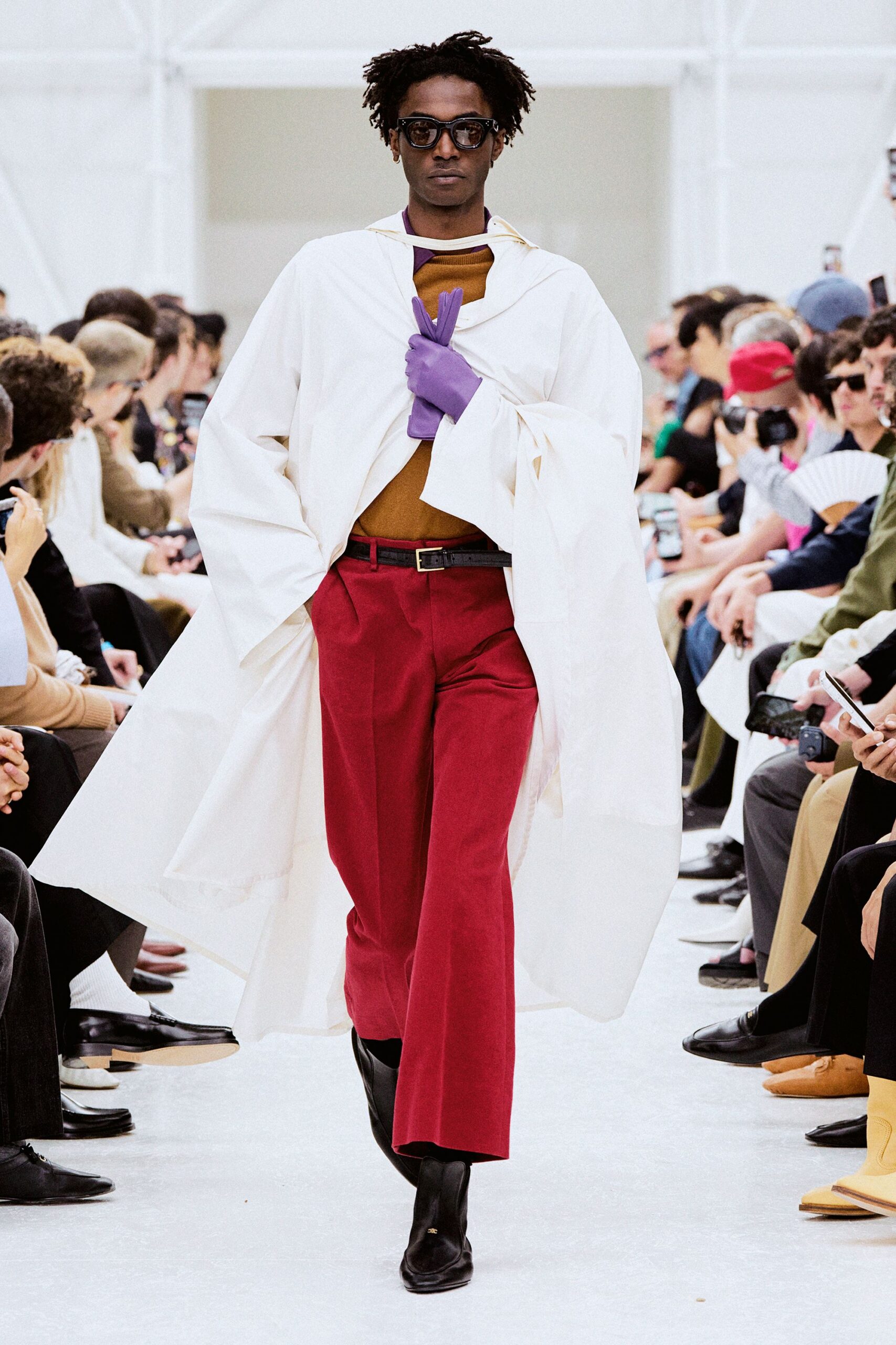 white coat brown top red pants