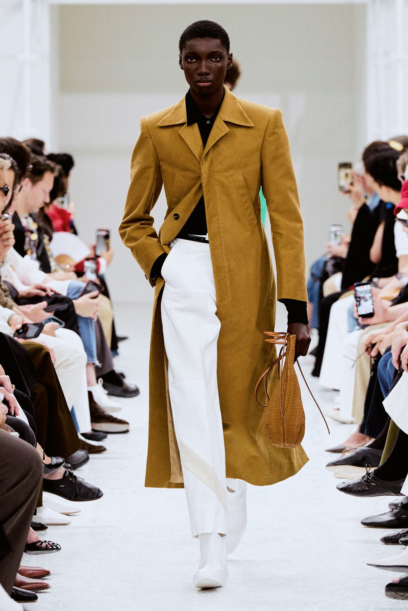 brown tailored coat with white pants