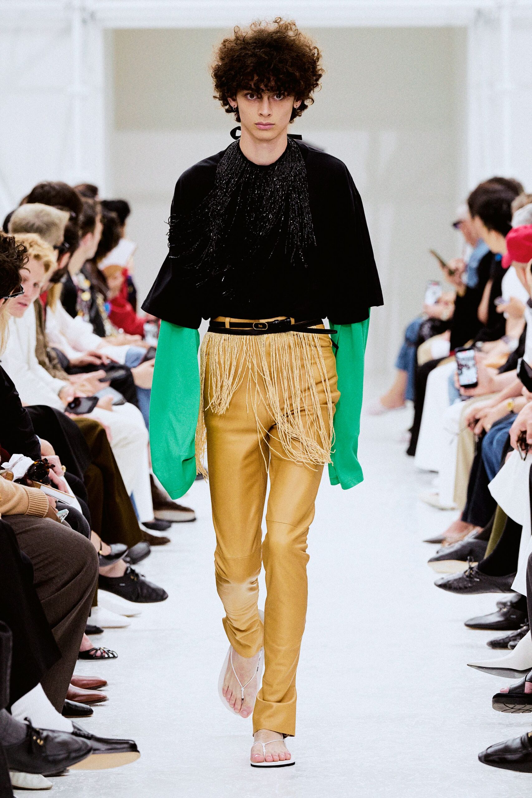 black and green relaxed top with gold pants