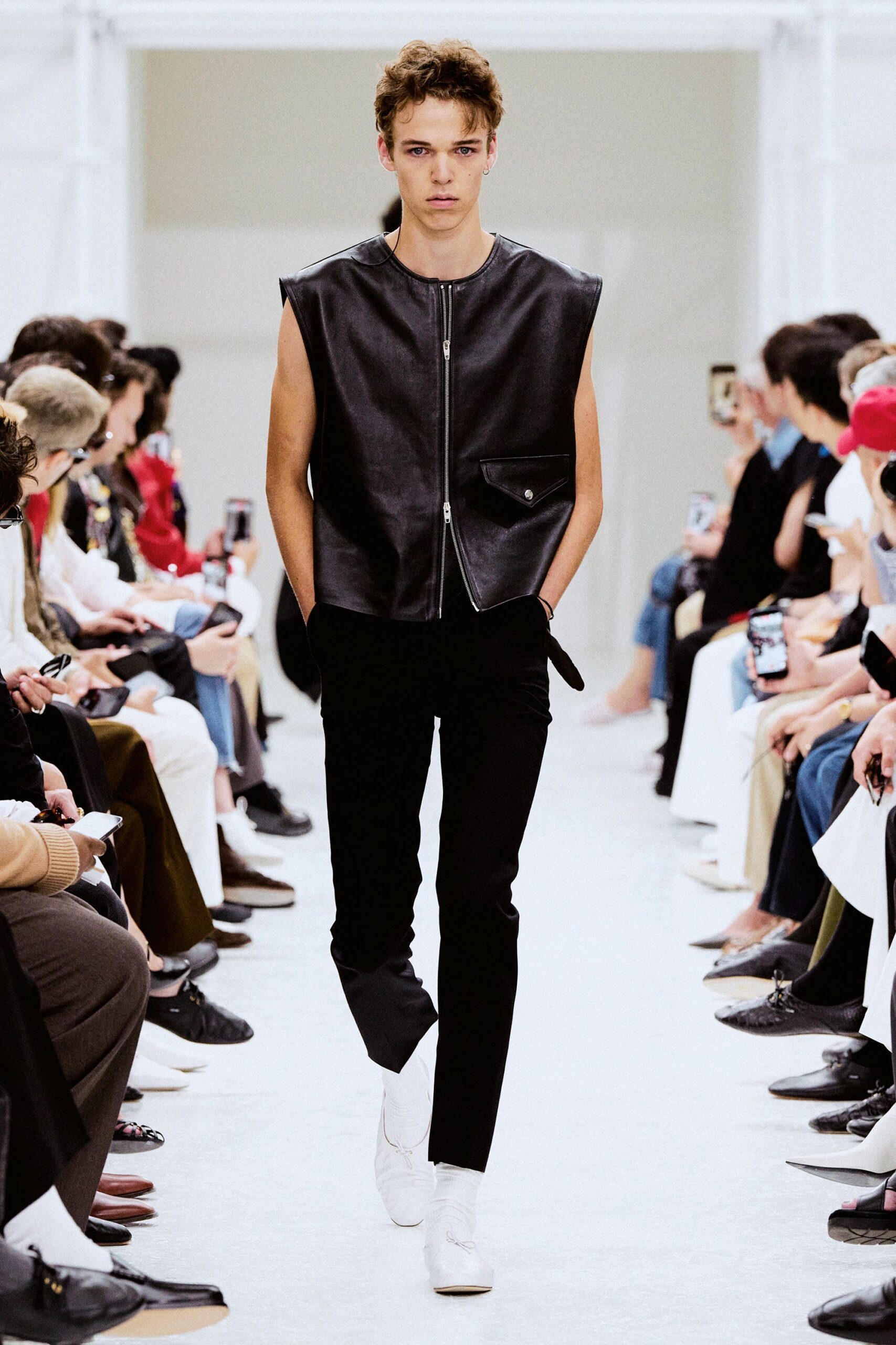 black leather fitted vest with slim pants