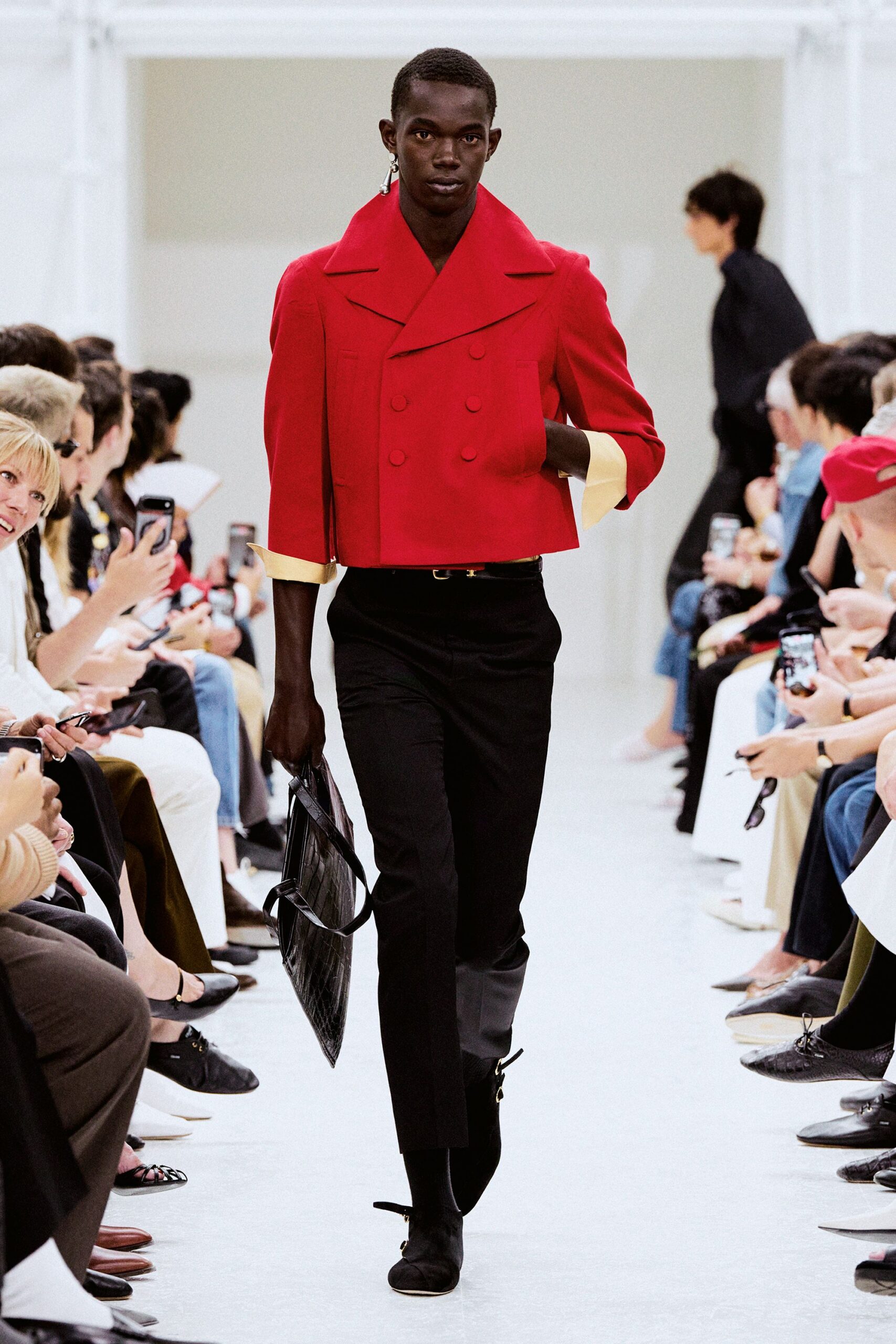 red structured jacket with black pants
