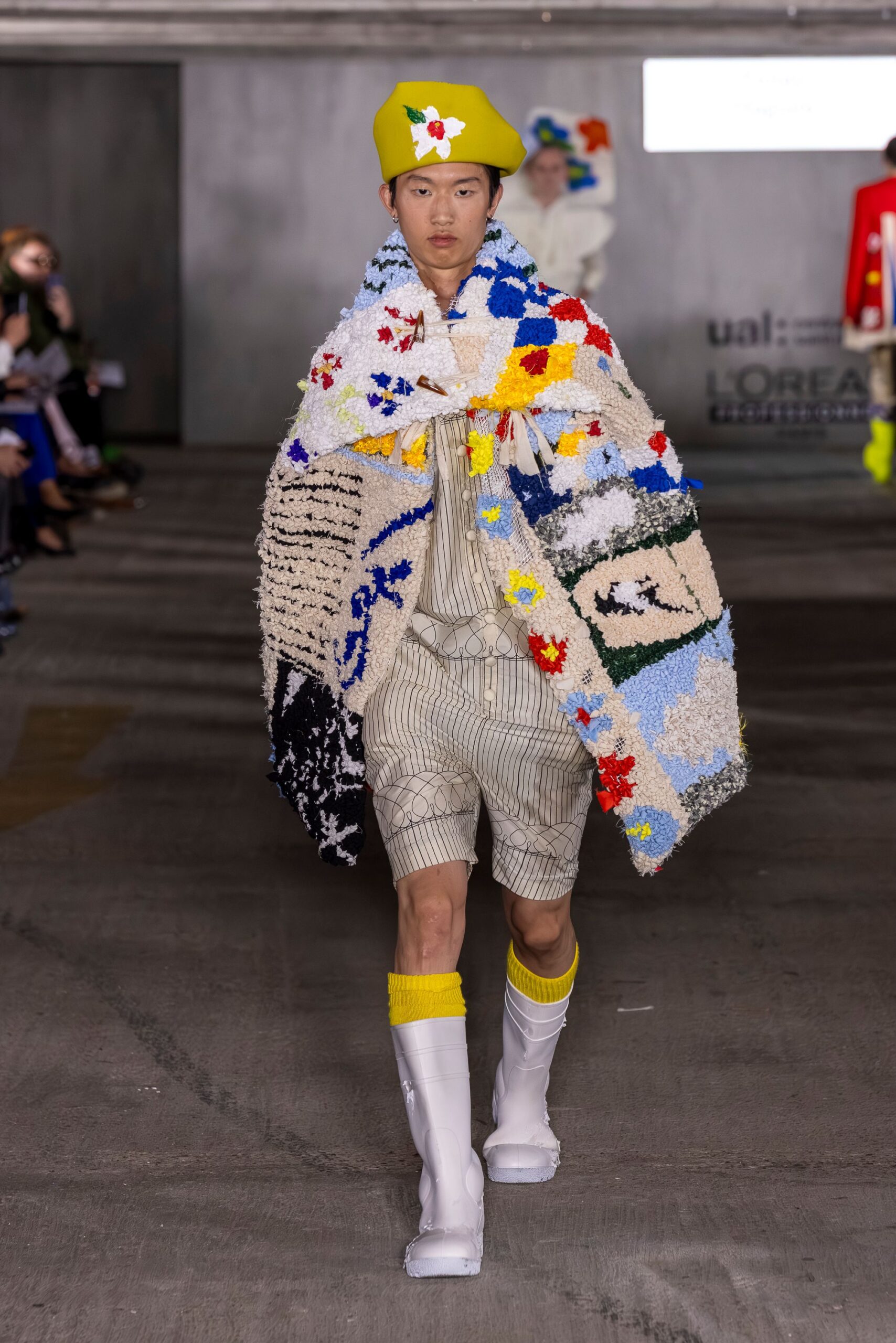 multi-colored coat with shorts and yellow hat