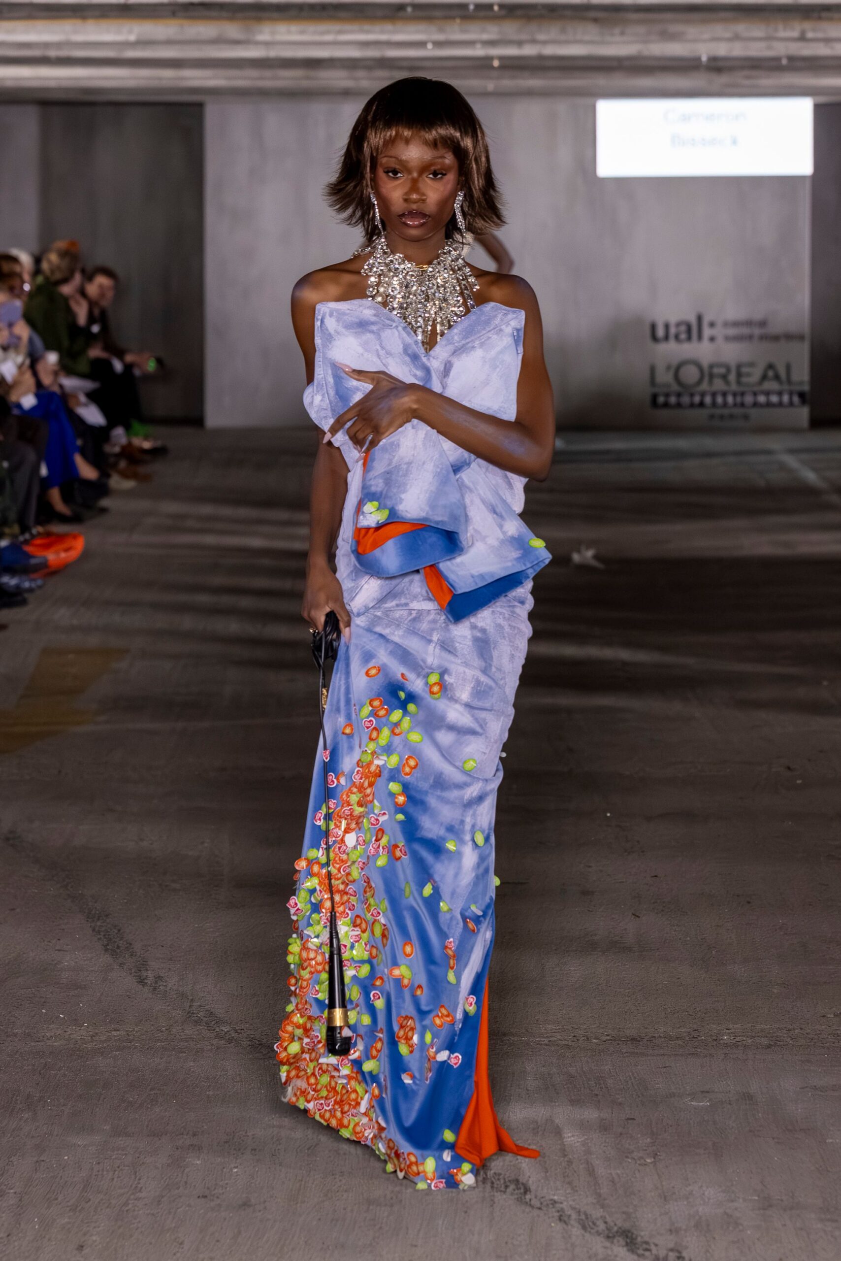 blue silk sleeveless off-shoulder fitted draped embellished gown