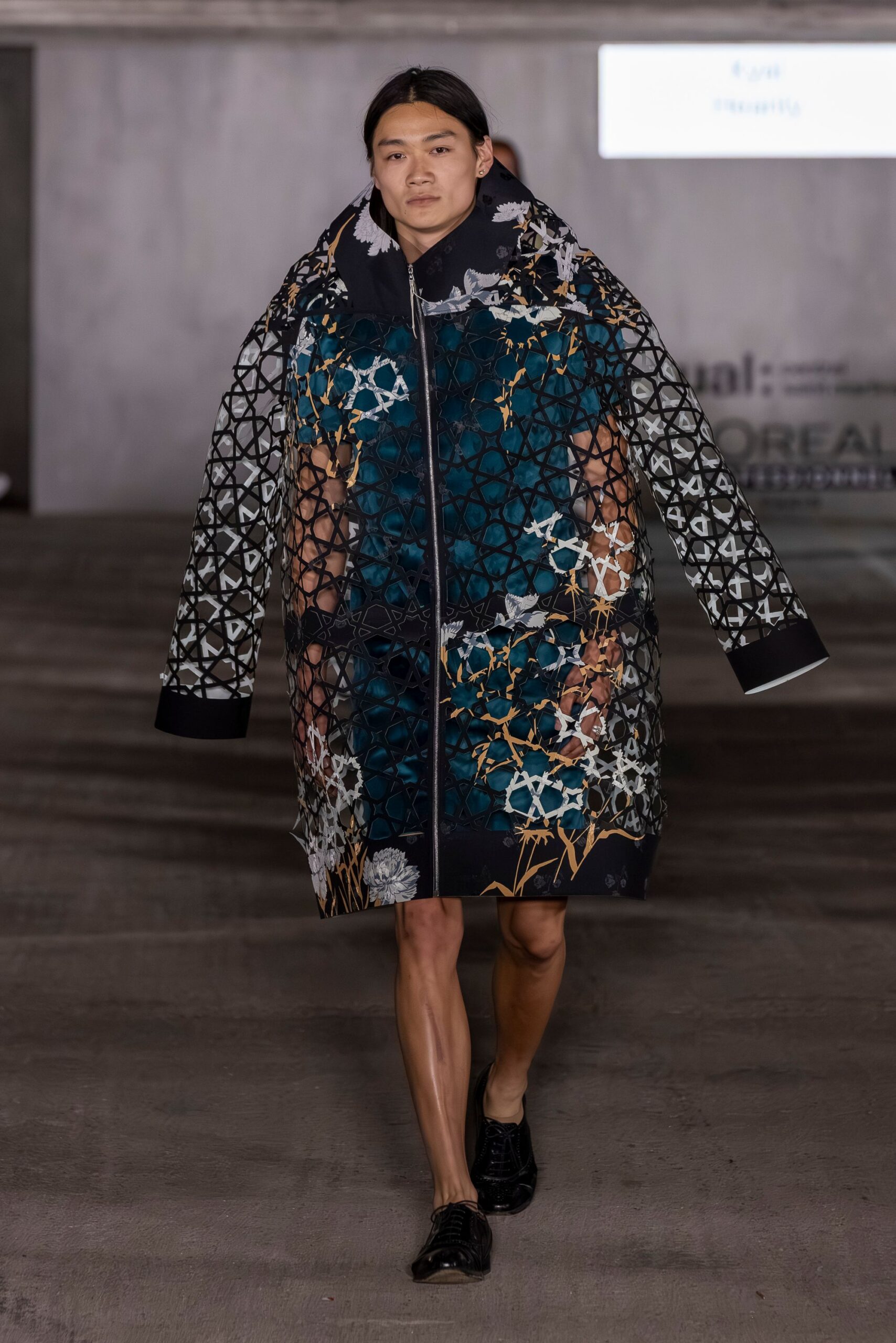 black long-sleeve collared oversized printed layered coat