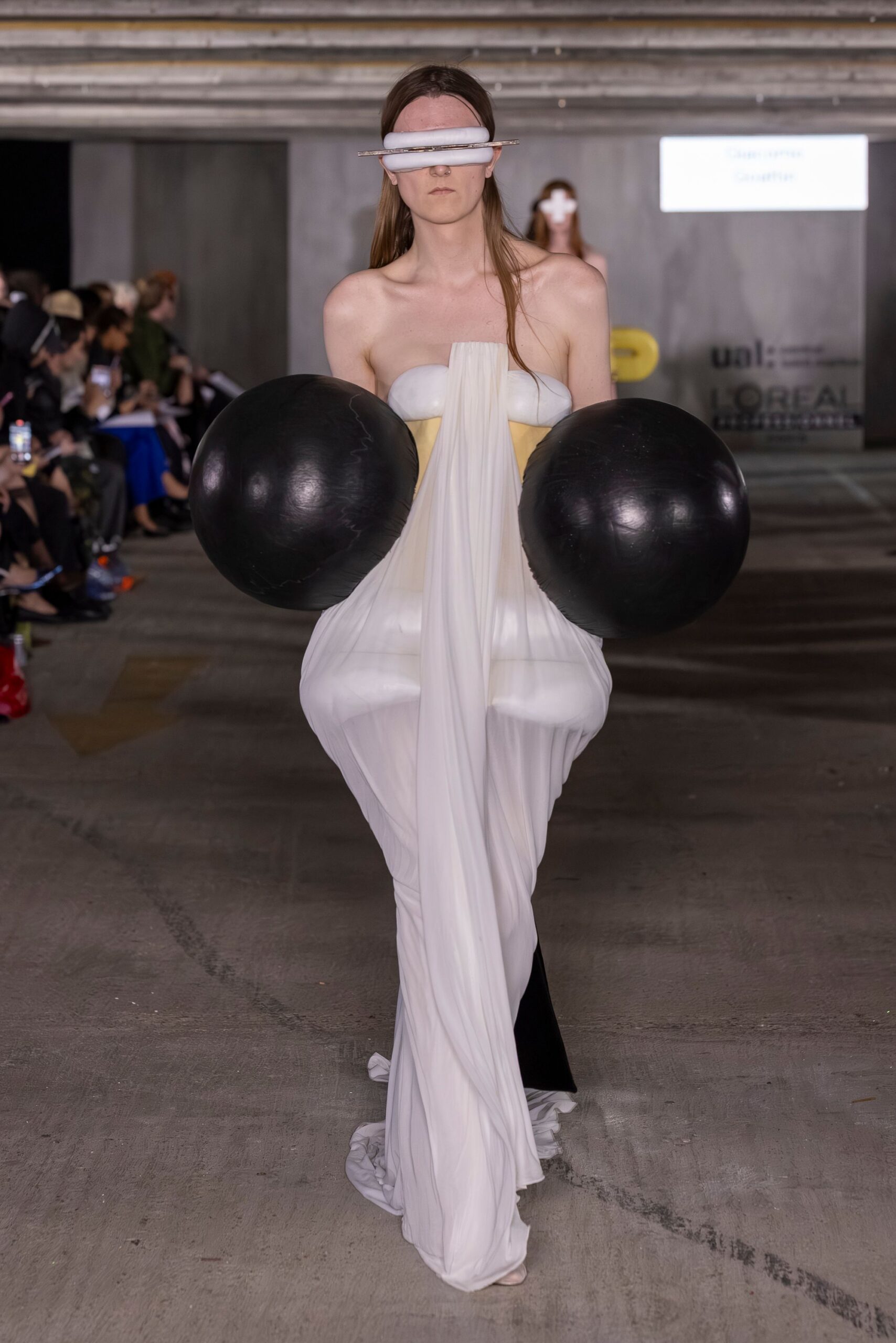 white draped maxi dress with black accessory