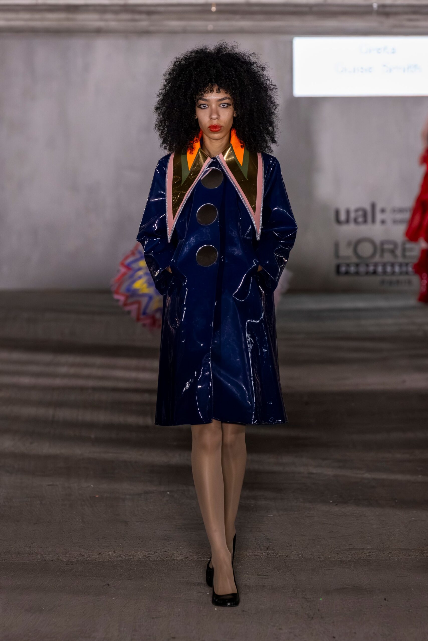blue vinyl long-sleeve collared fitted buttoned shiny coat