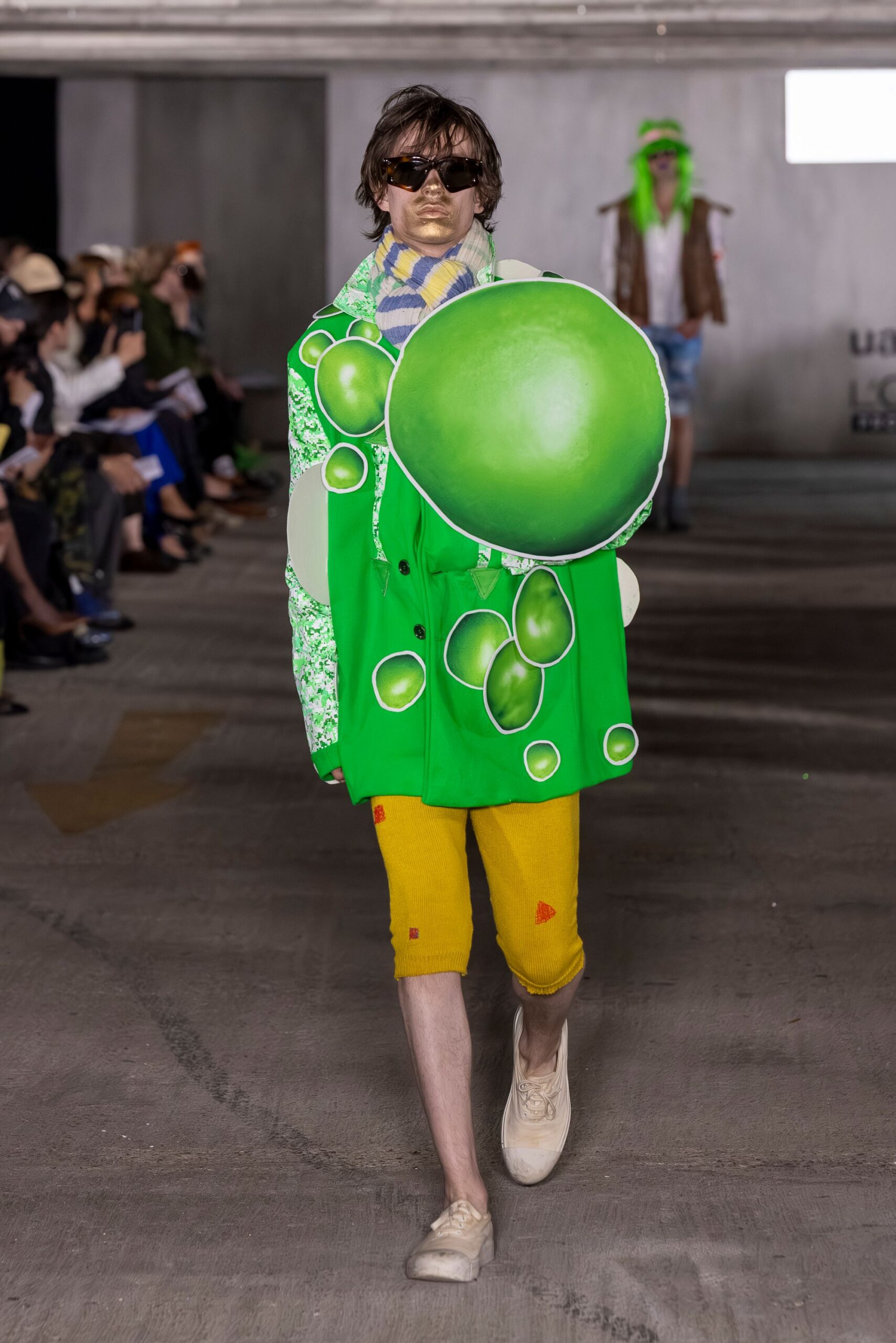 oversized green jacket with yellow shorts