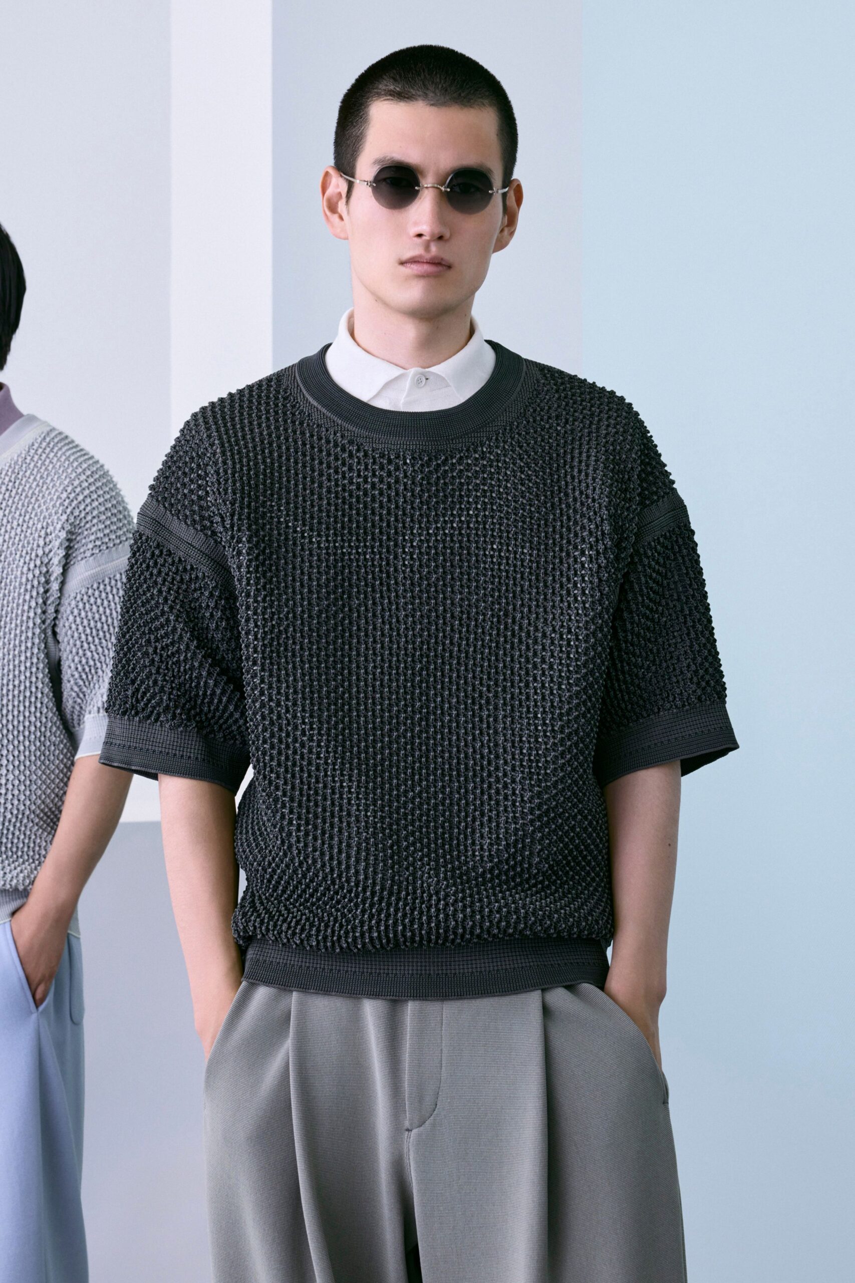 black textured sweater with gray pants