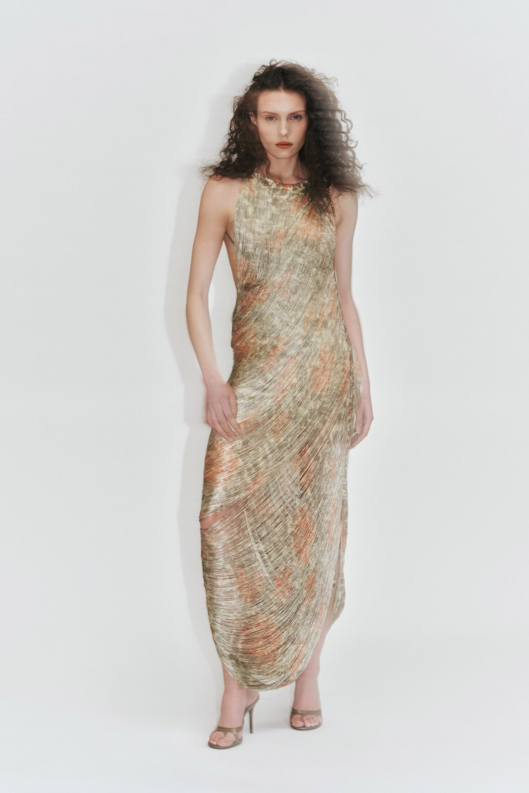 gold silk sleeveless high-neck fitted draped flowing gown