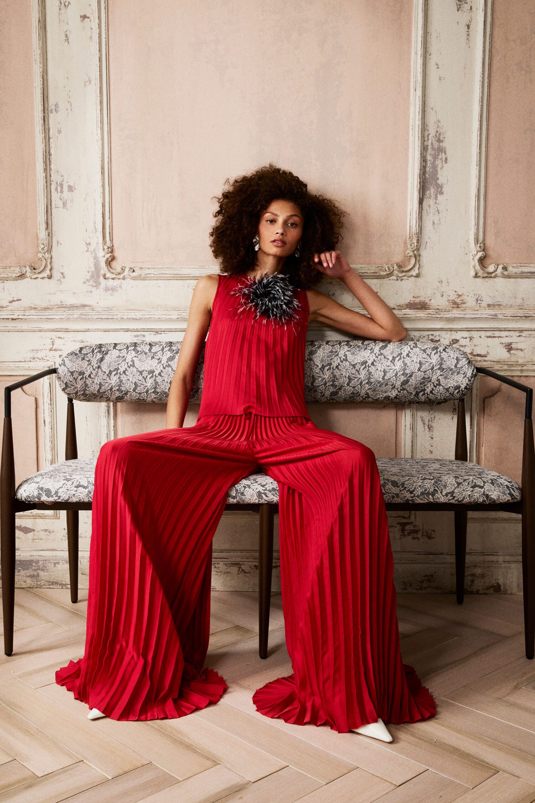 red silk sleeveless high-neck fitted pleated jumpsuit