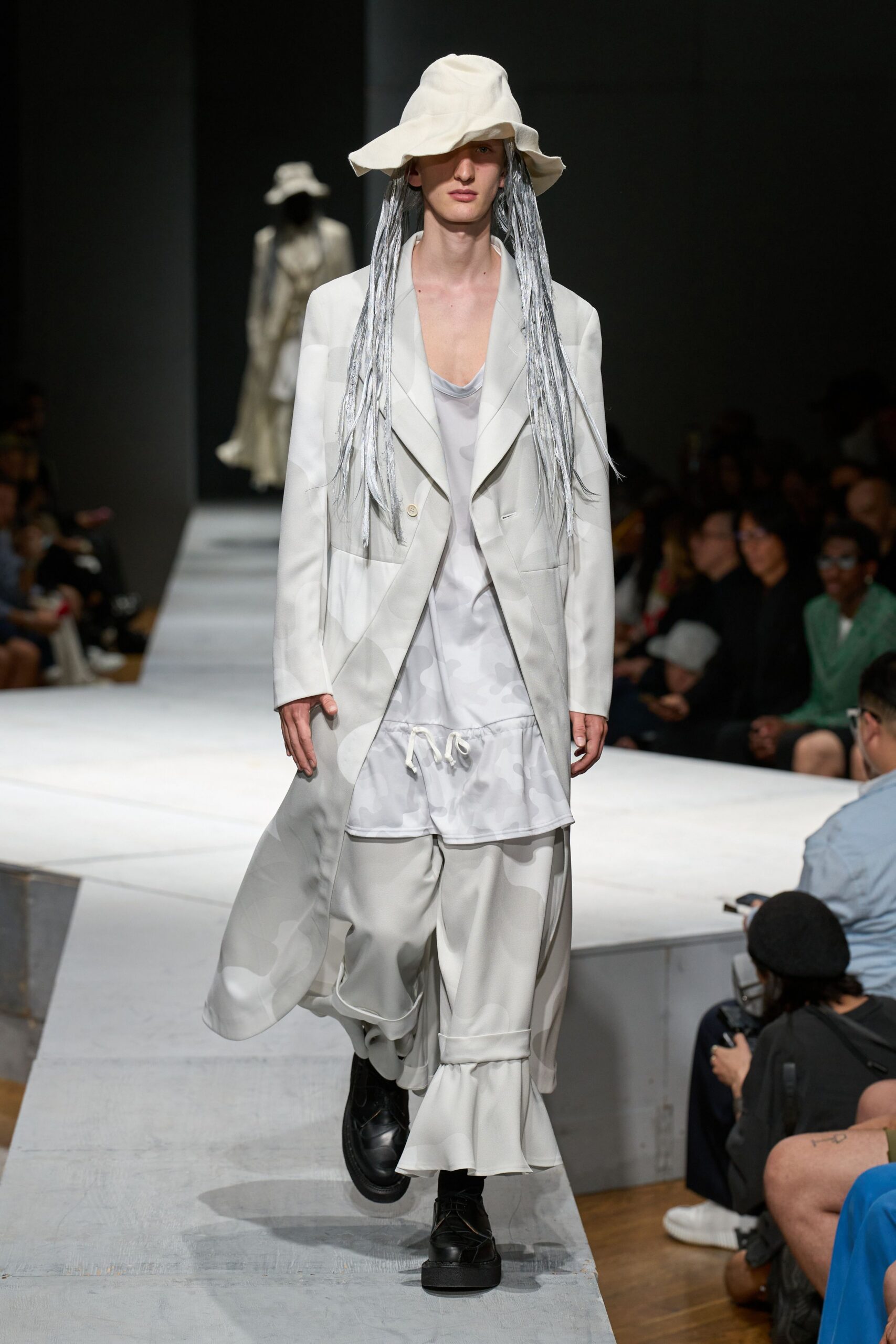 white coat and black shoes