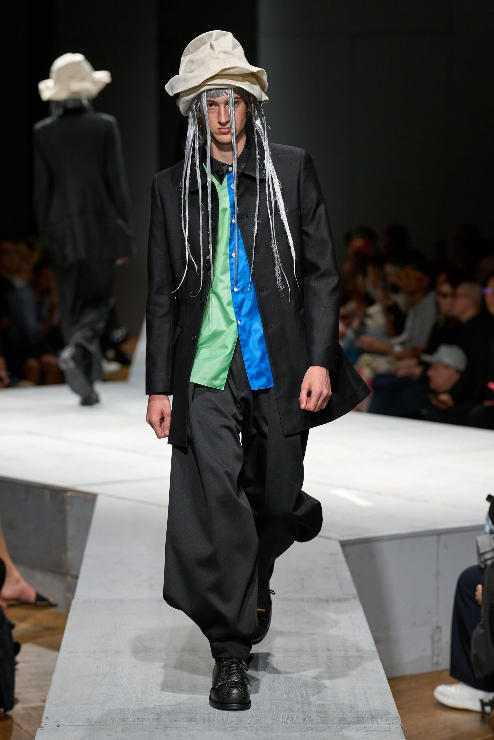 black suit with colorful shirt