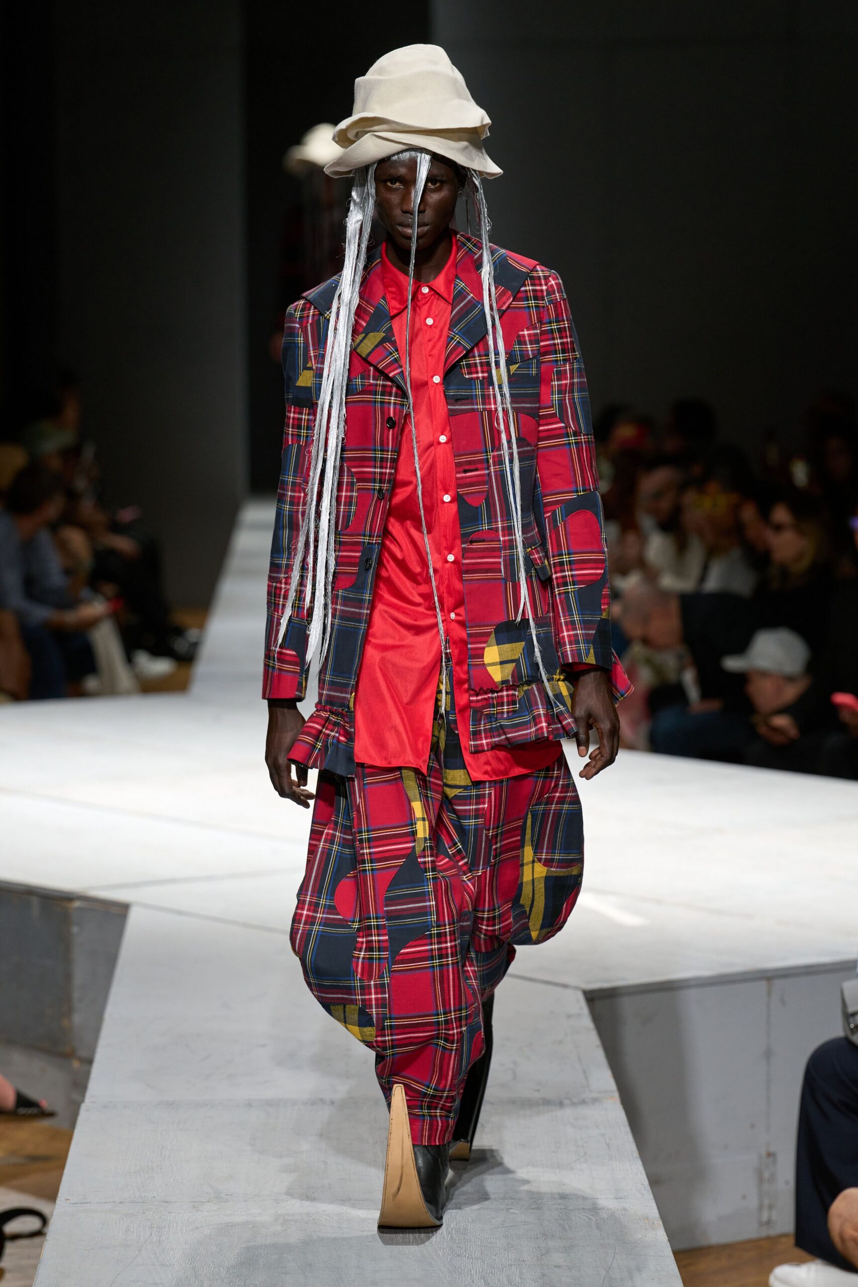 checked suit with red shirt