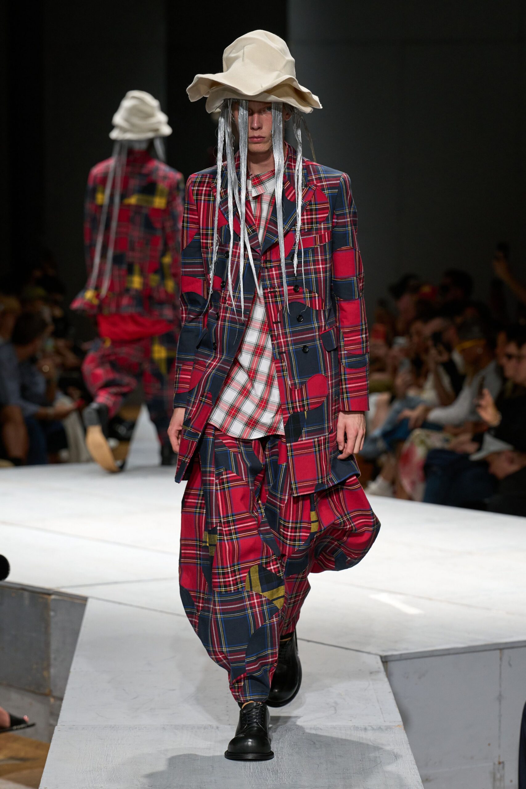 plaid suit with beige hat