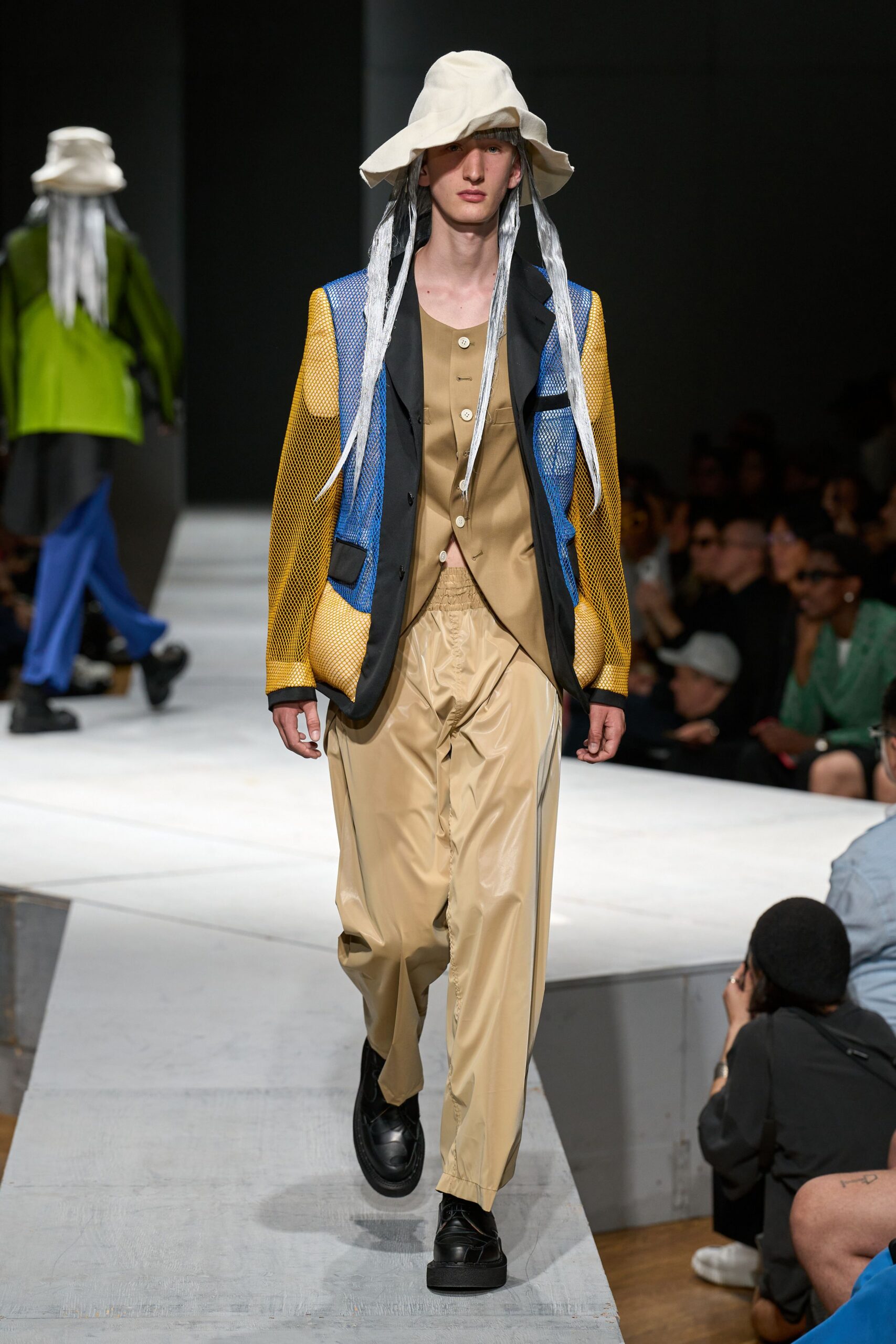 color-blocked blazer with beige pants