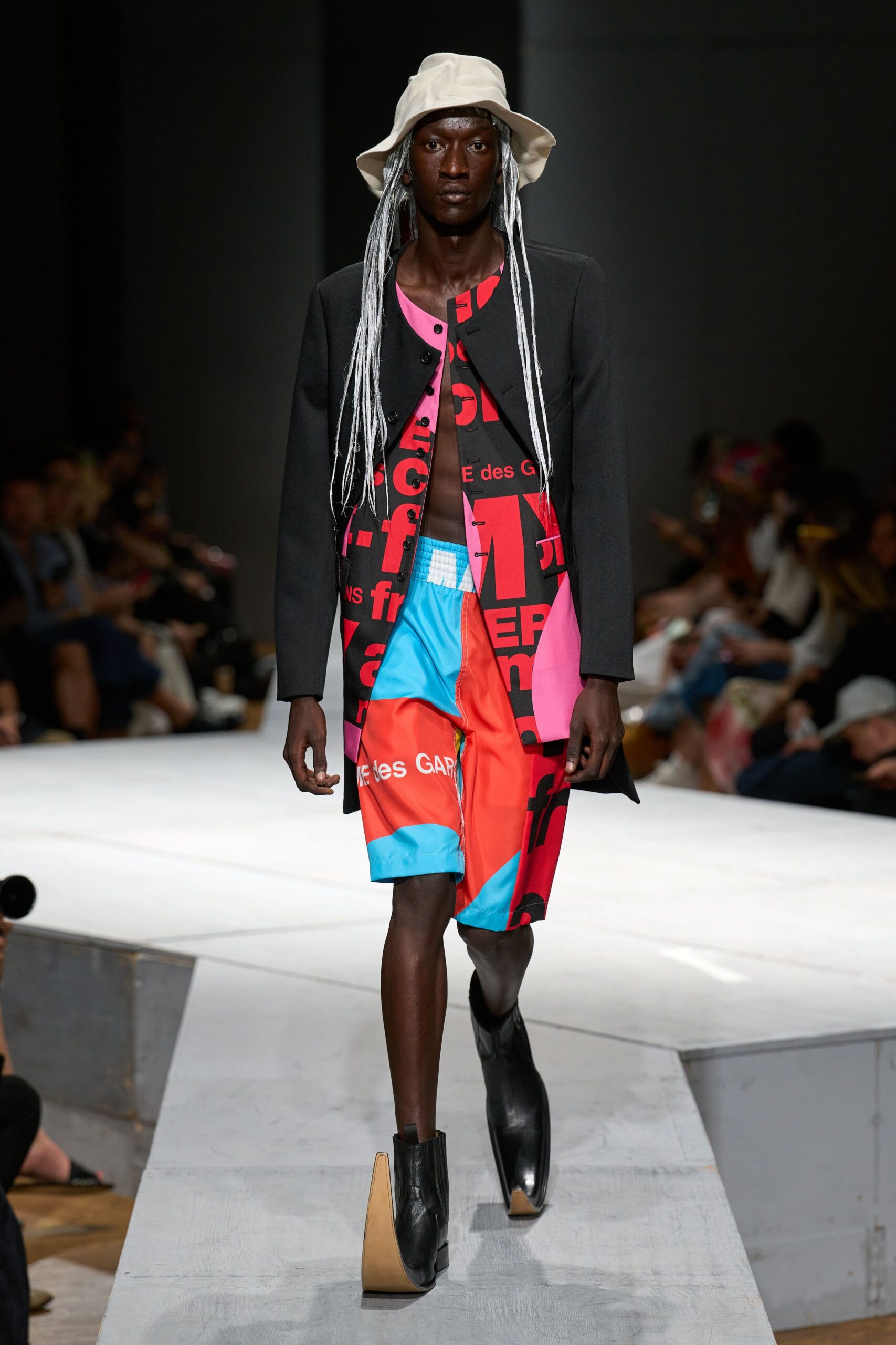 black coat over color-blocked dress