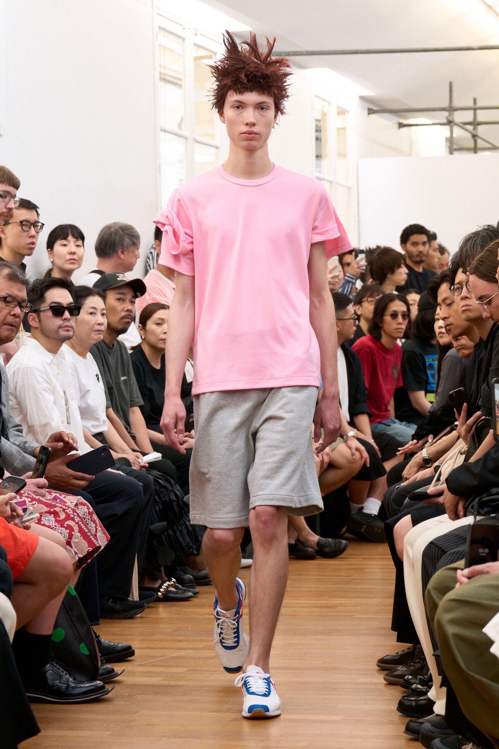 pink t-shirt gray shorts sneakers