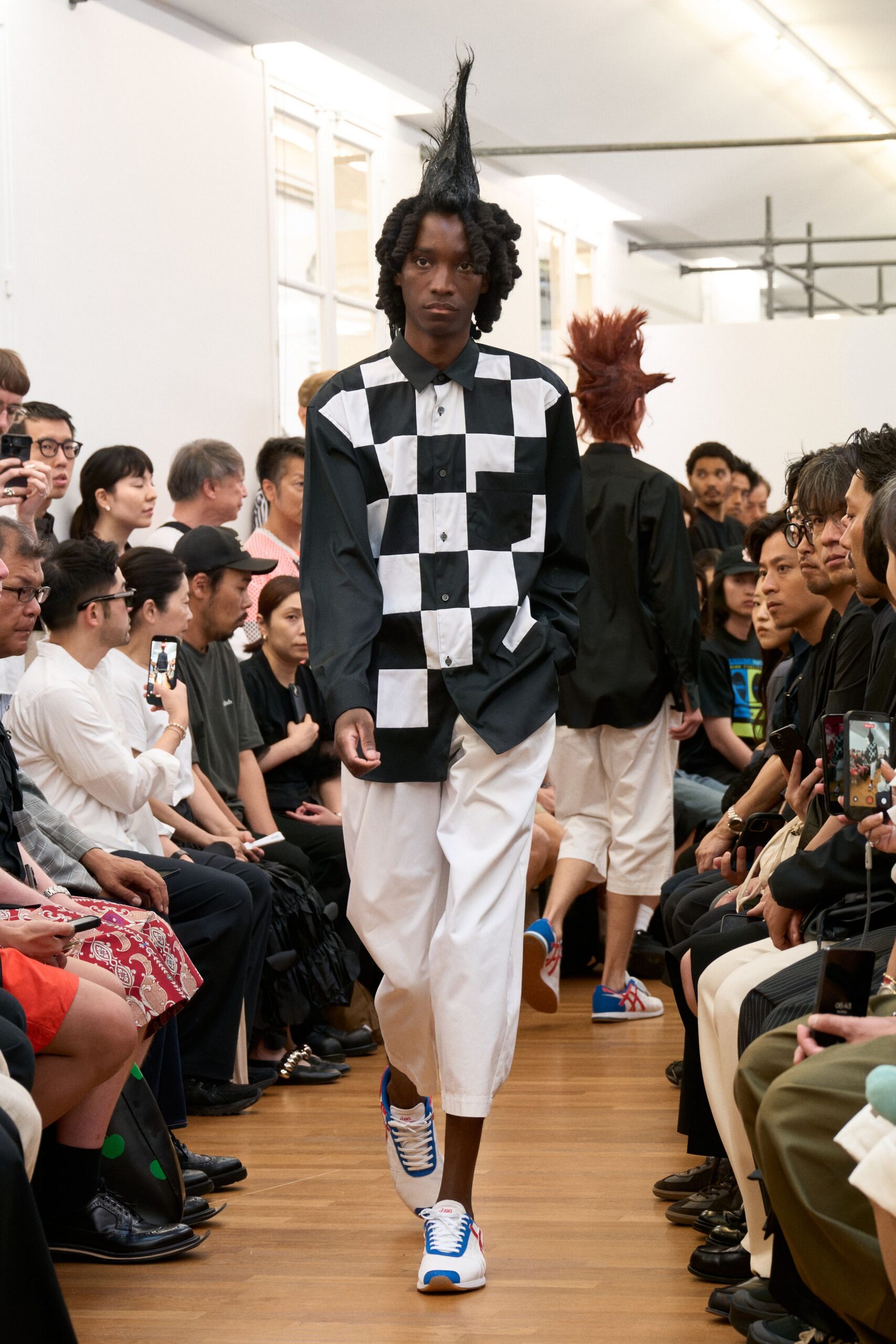 checked shirt white pants sneakers