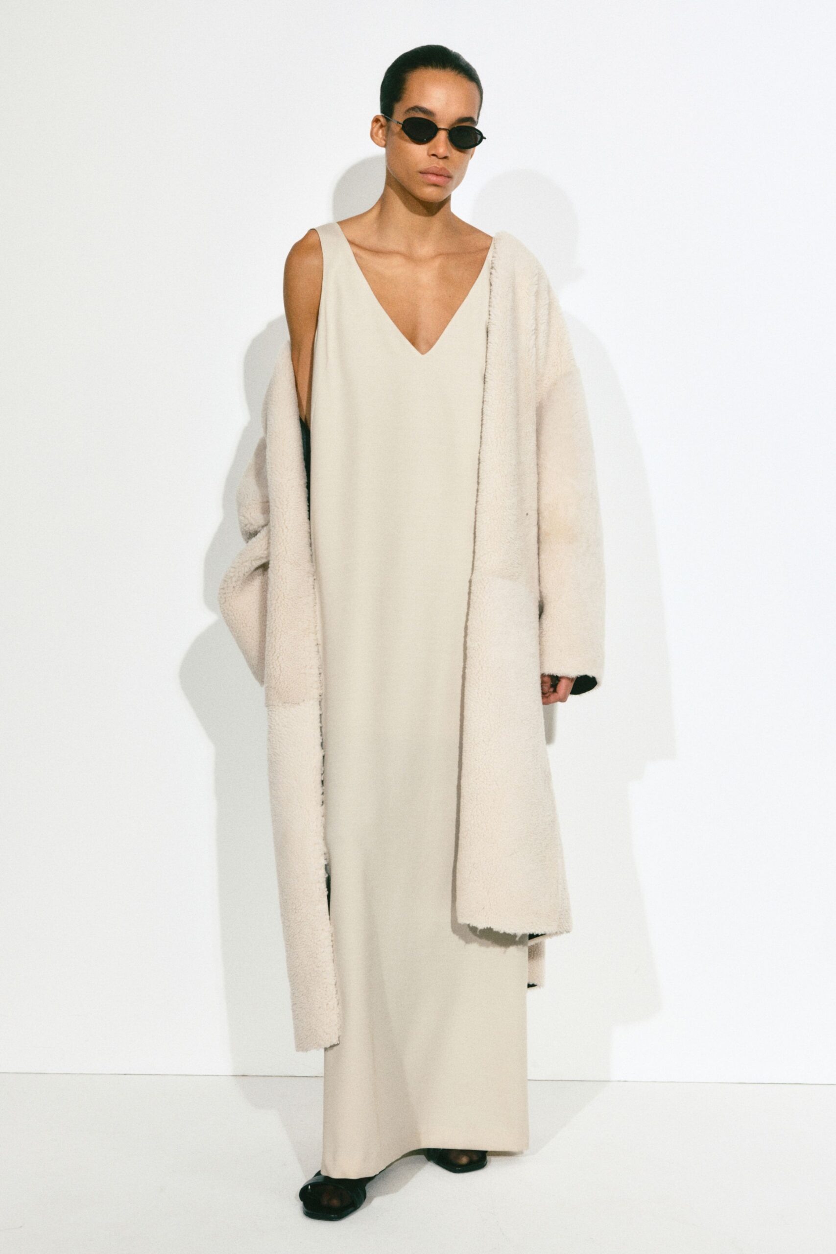 beige gown with faux-fur coat
