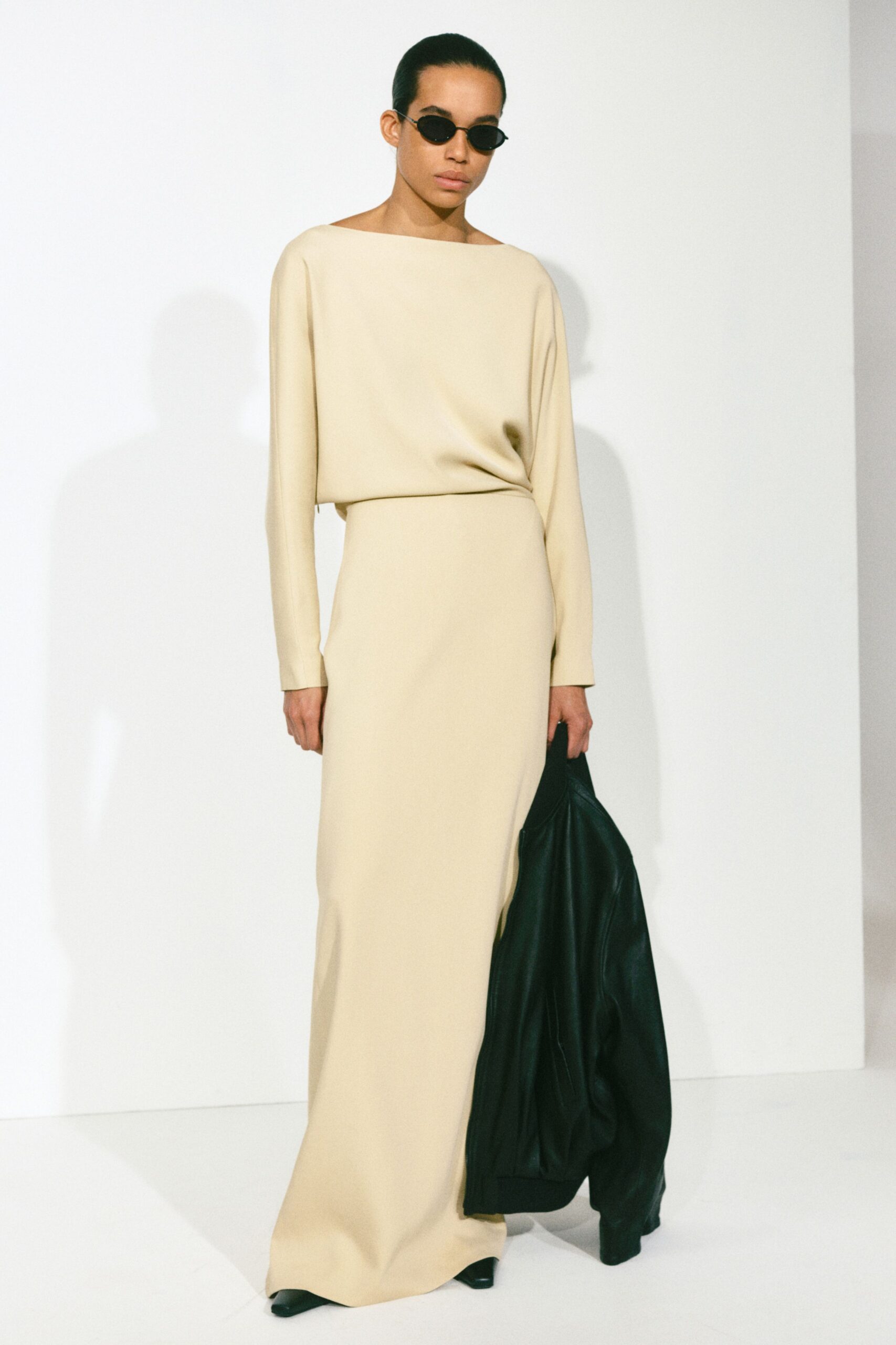 beige maxi dress with black leather jacket