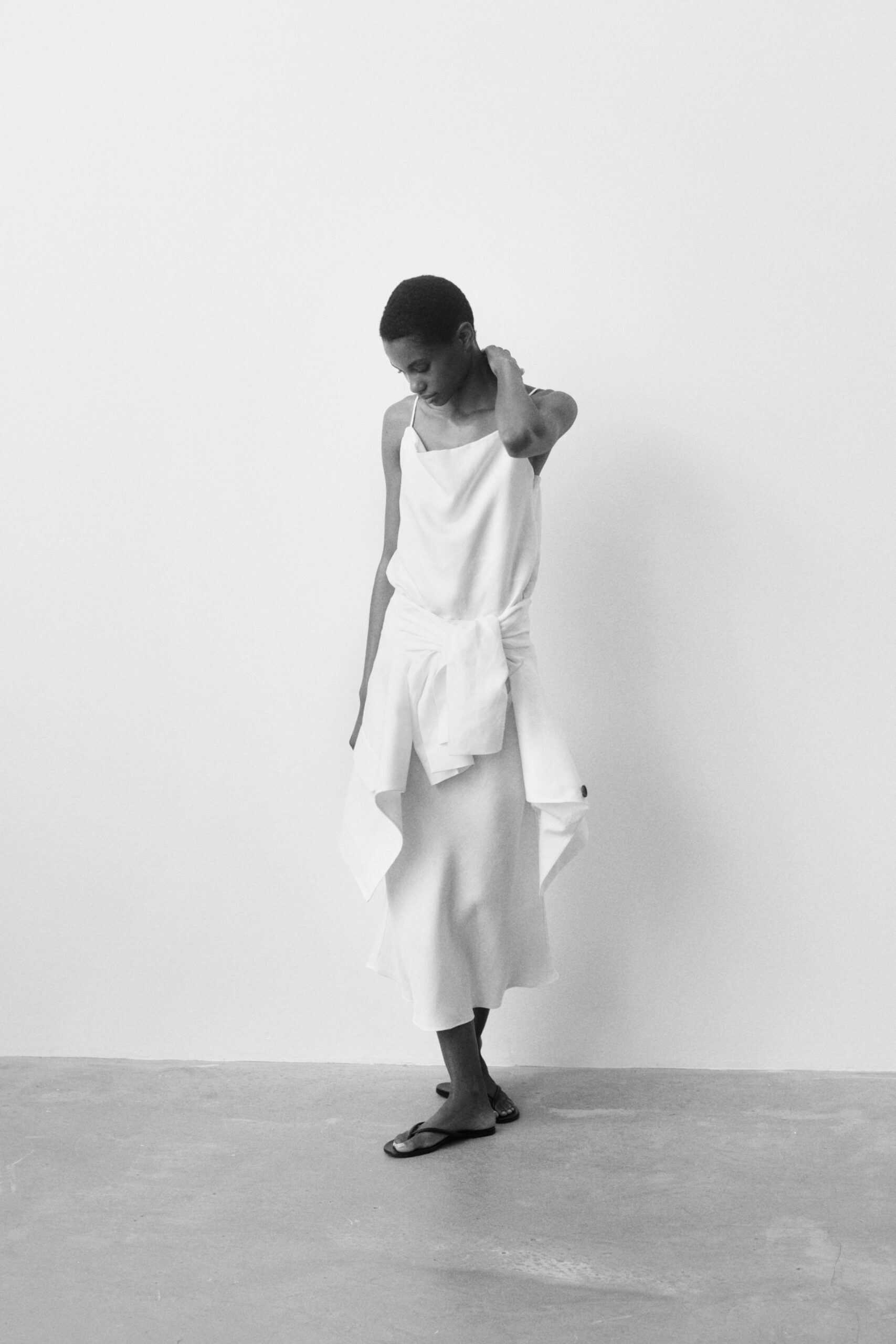 white silk sleeveless v-neck fitted draped flowing dress
