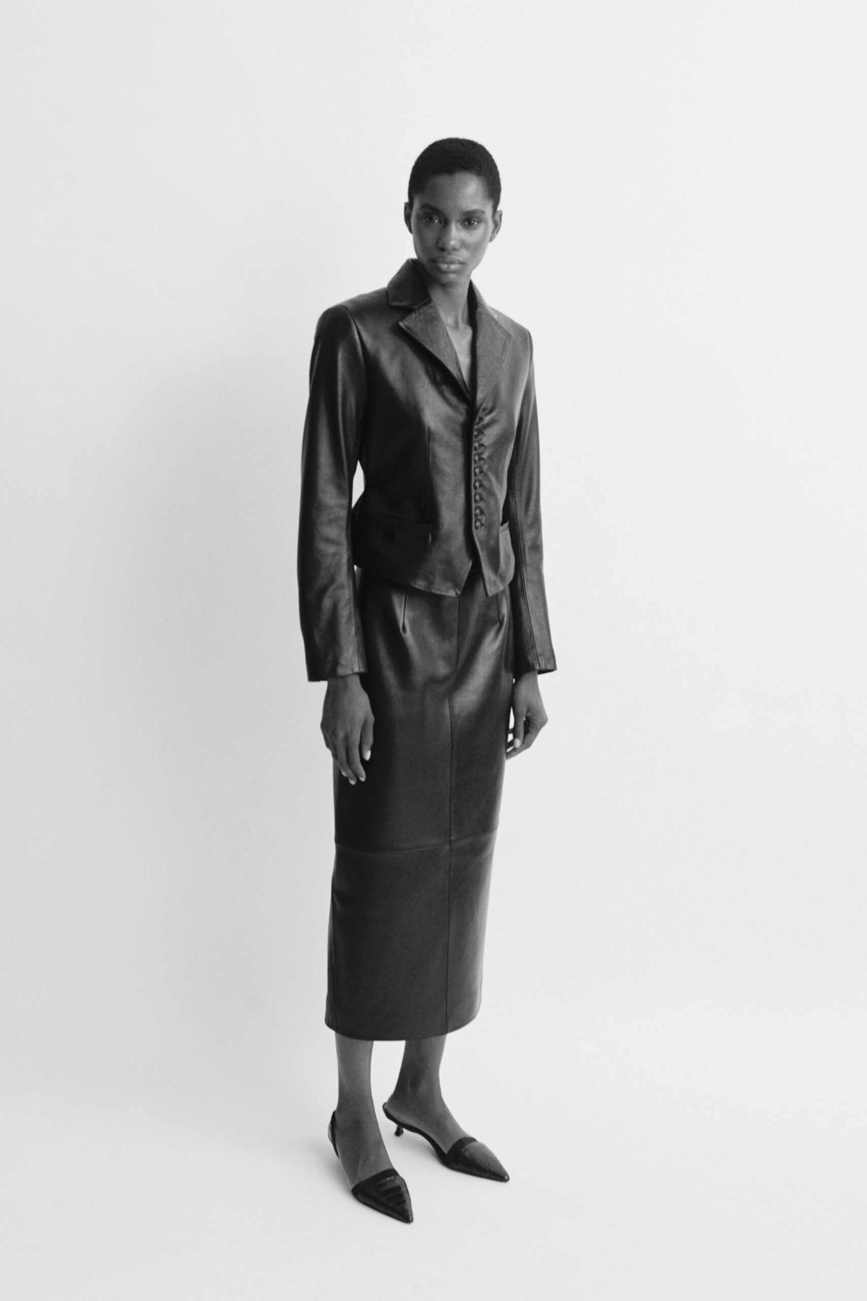 black leather fitted pencil midi skirt