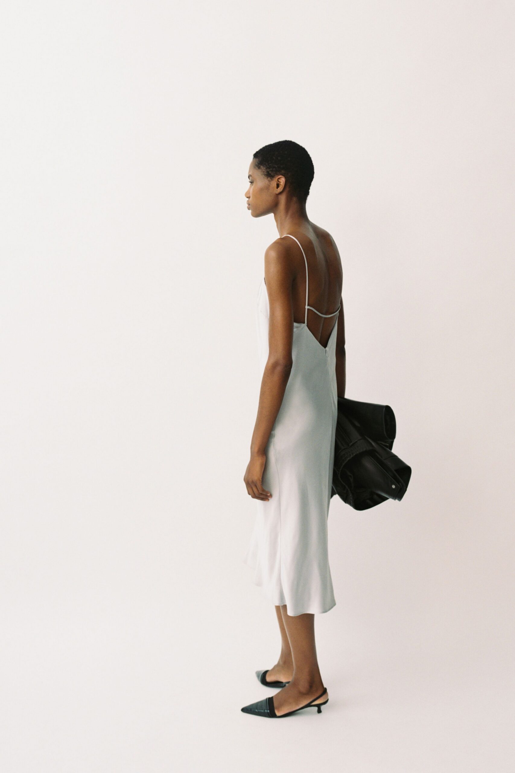 white silk sleeveless v-neck fitted a-line flowing dress