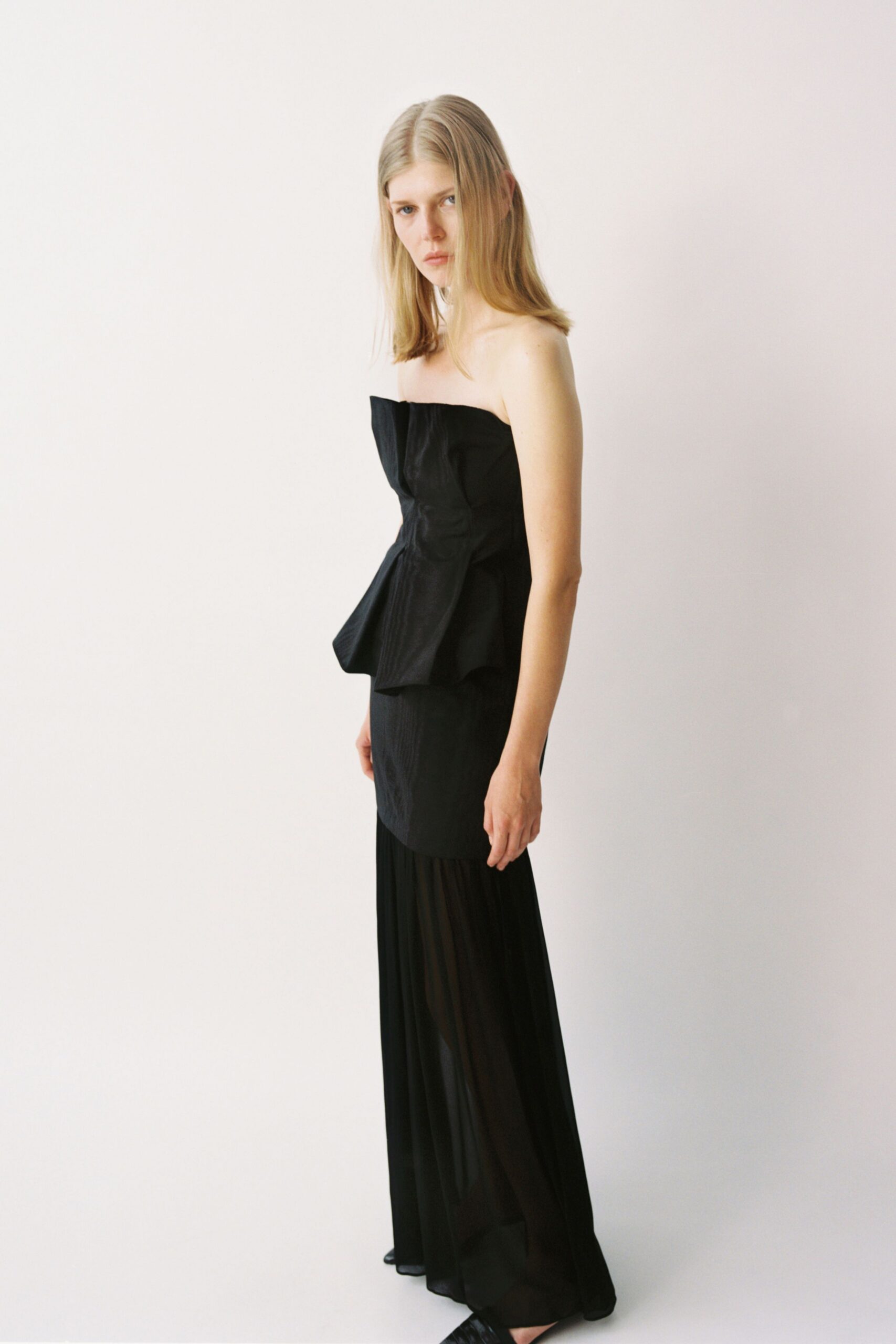black strapless pleated gown
