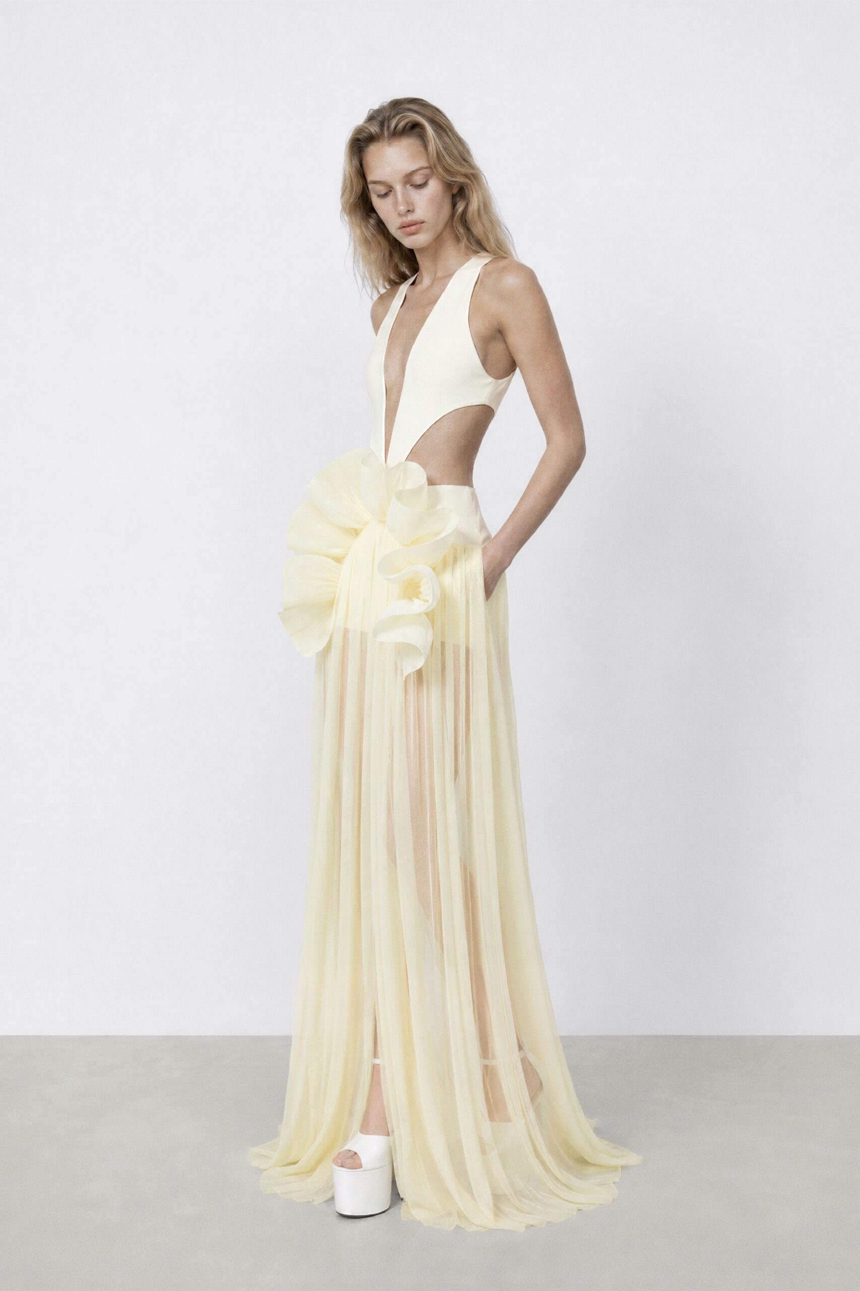 yellow chiffon sleeveless v-neck fitted draped flared gown