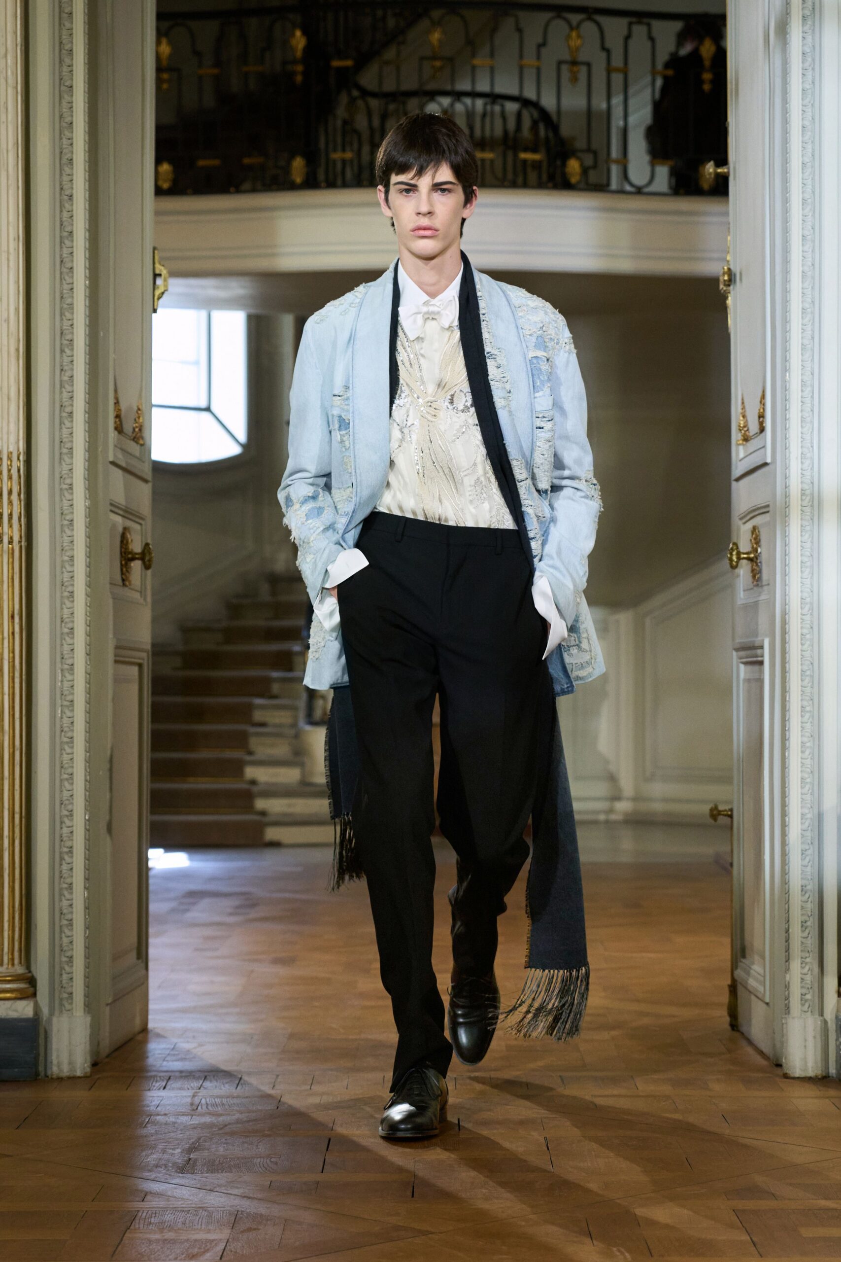 light blue denim jacket with black pants