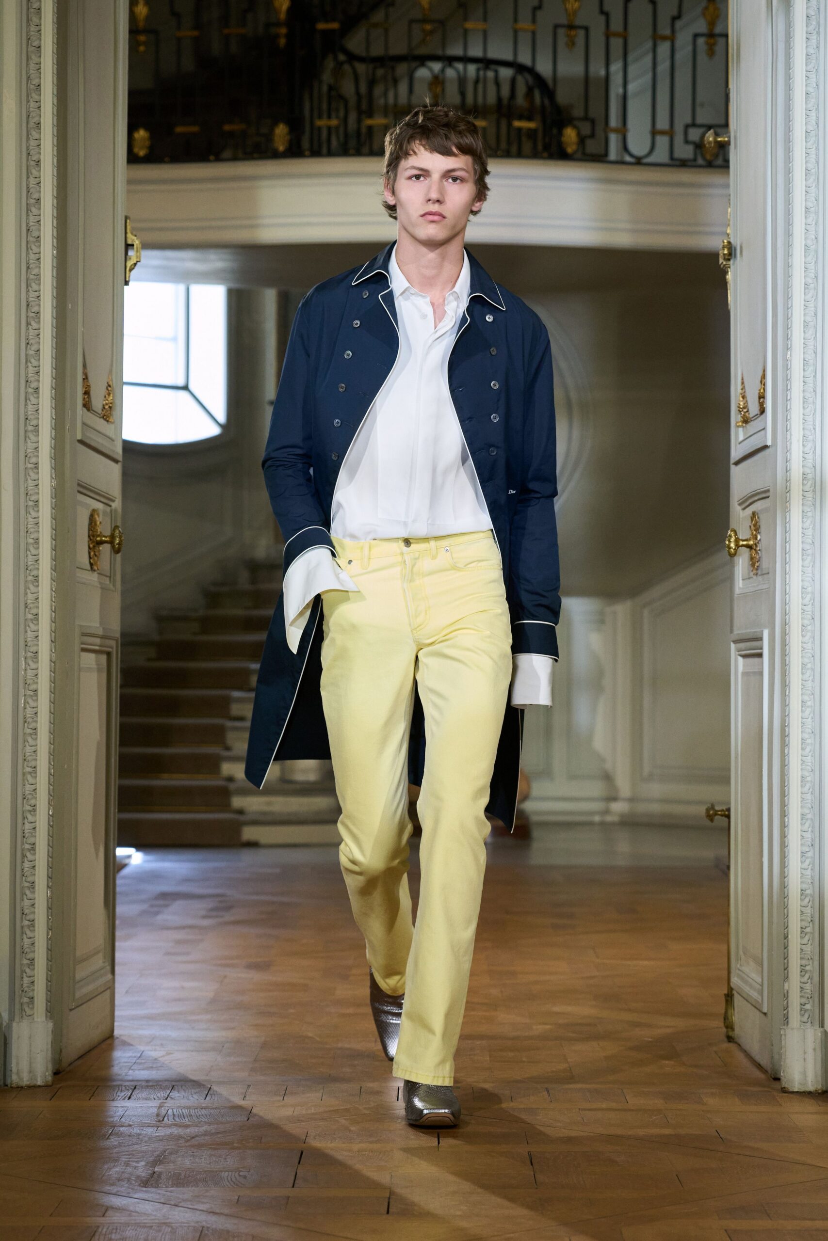blue coat white shirt yellow pants