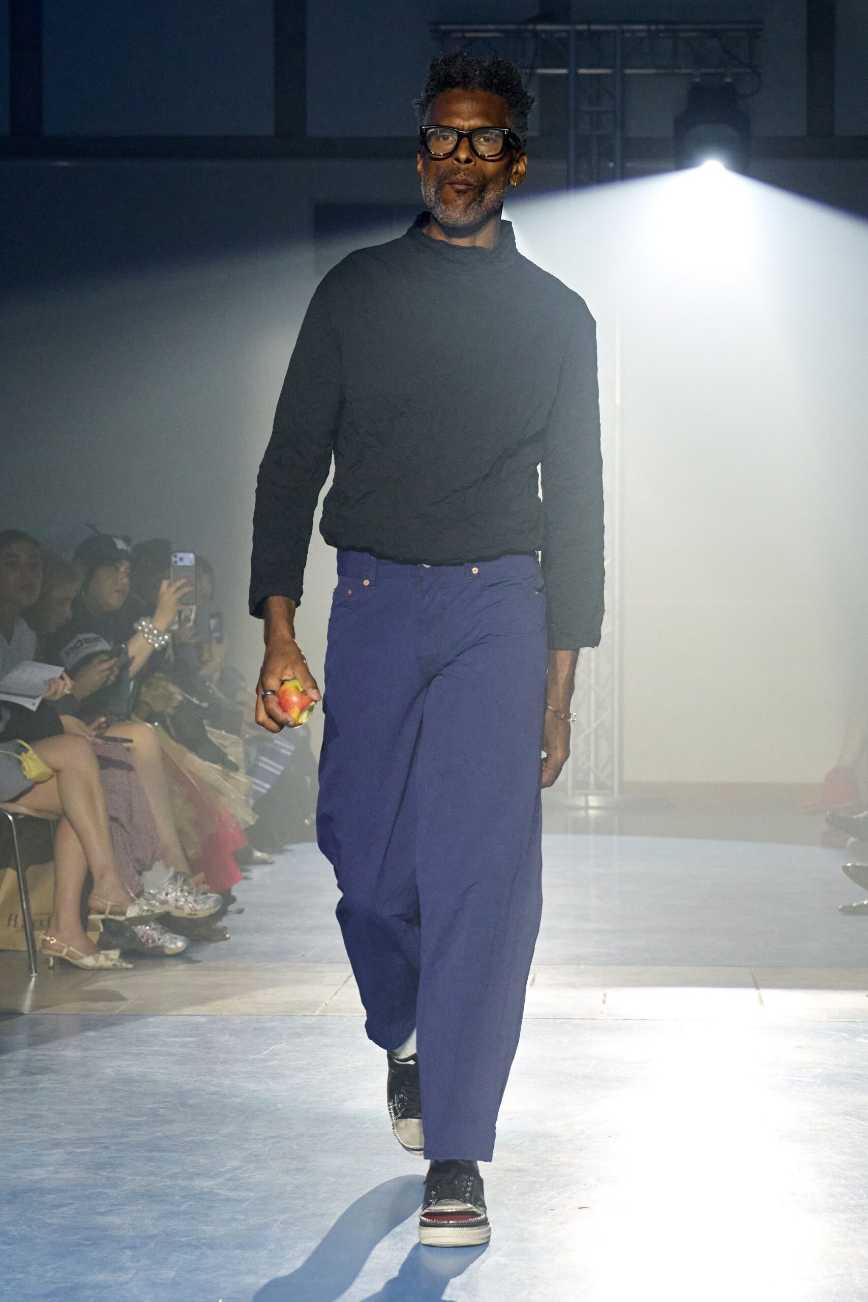 black sweater blue pants