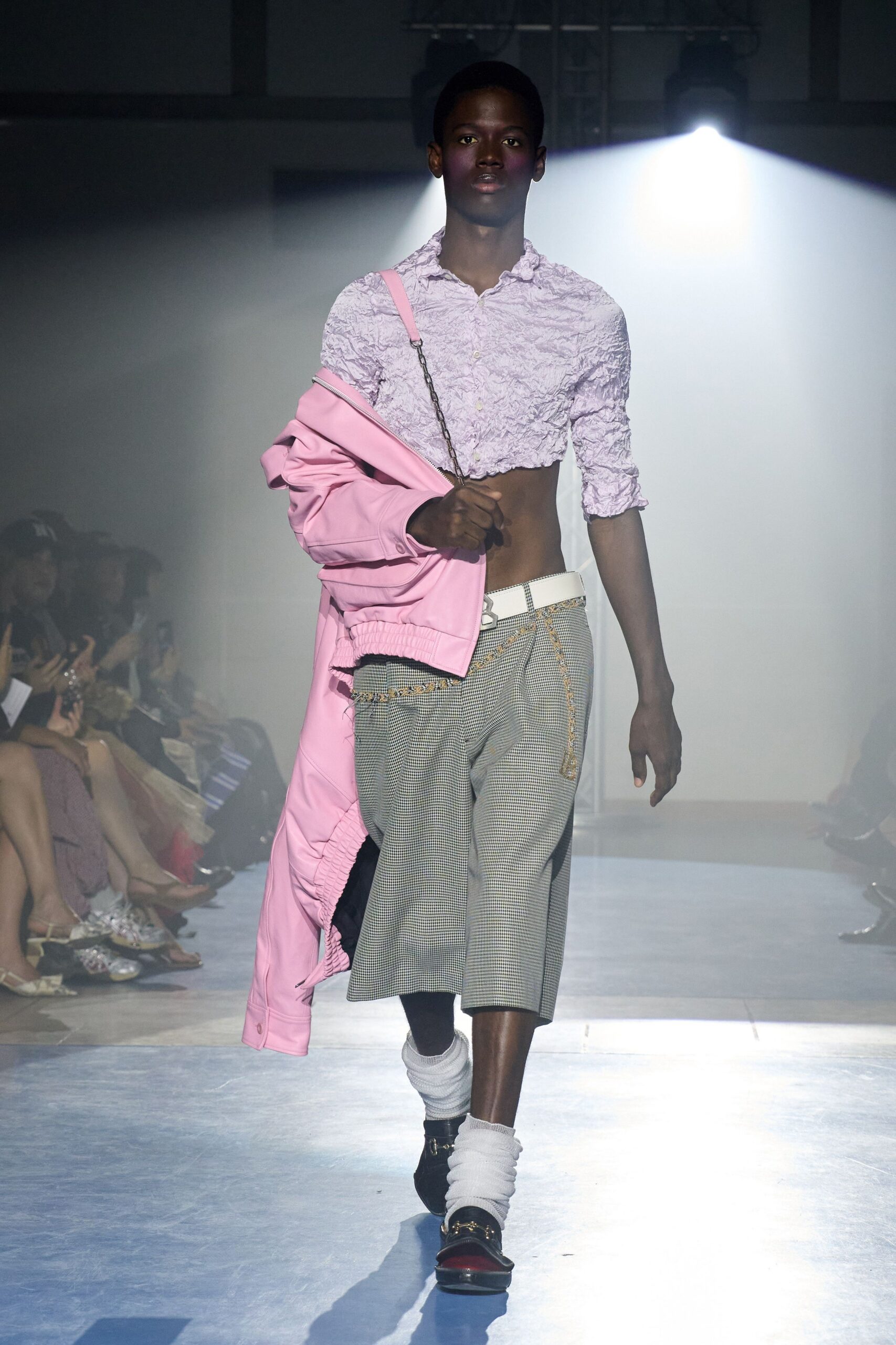 pink ruffled shirt with oversized coat