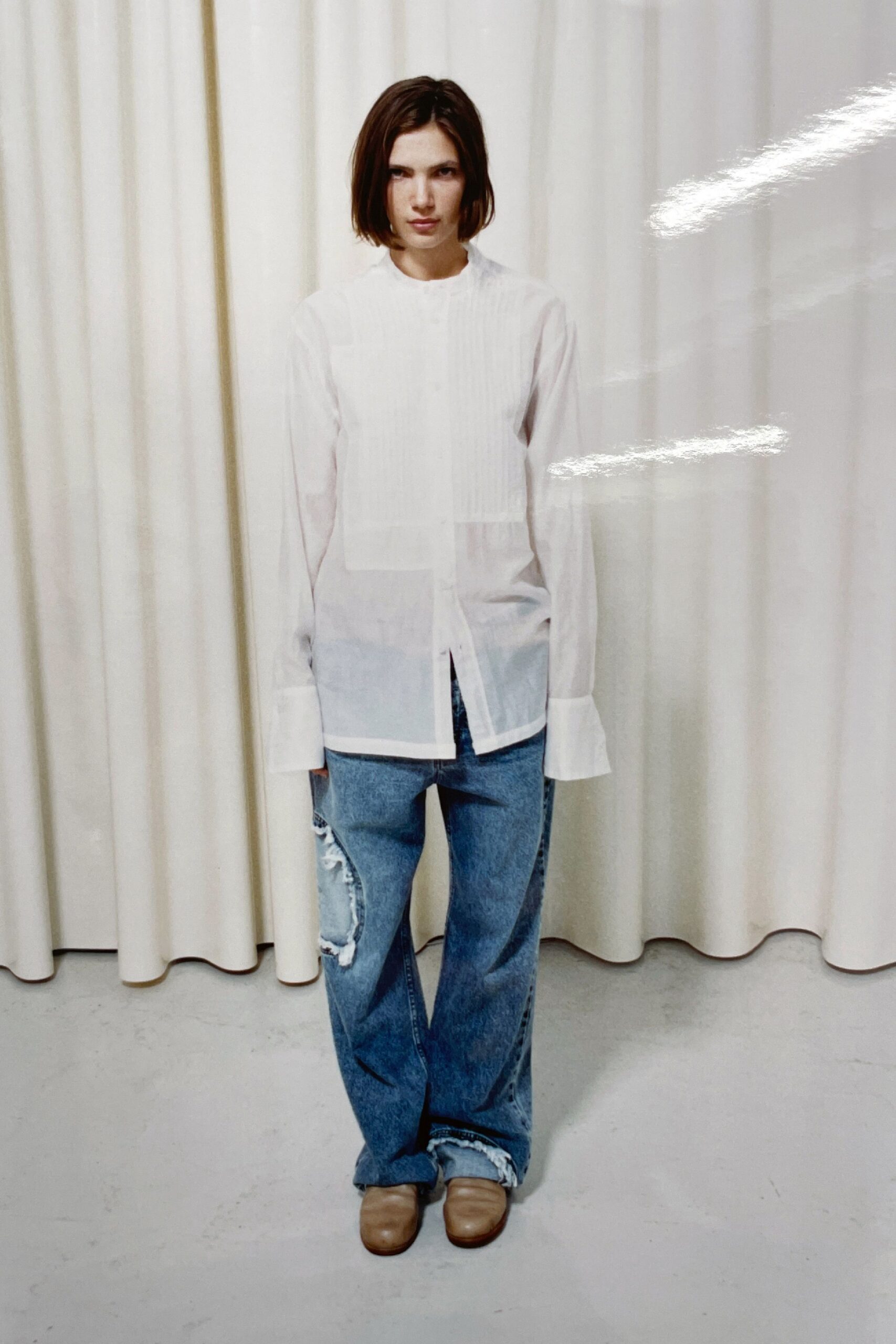 white relaxed shirt with blue jeans