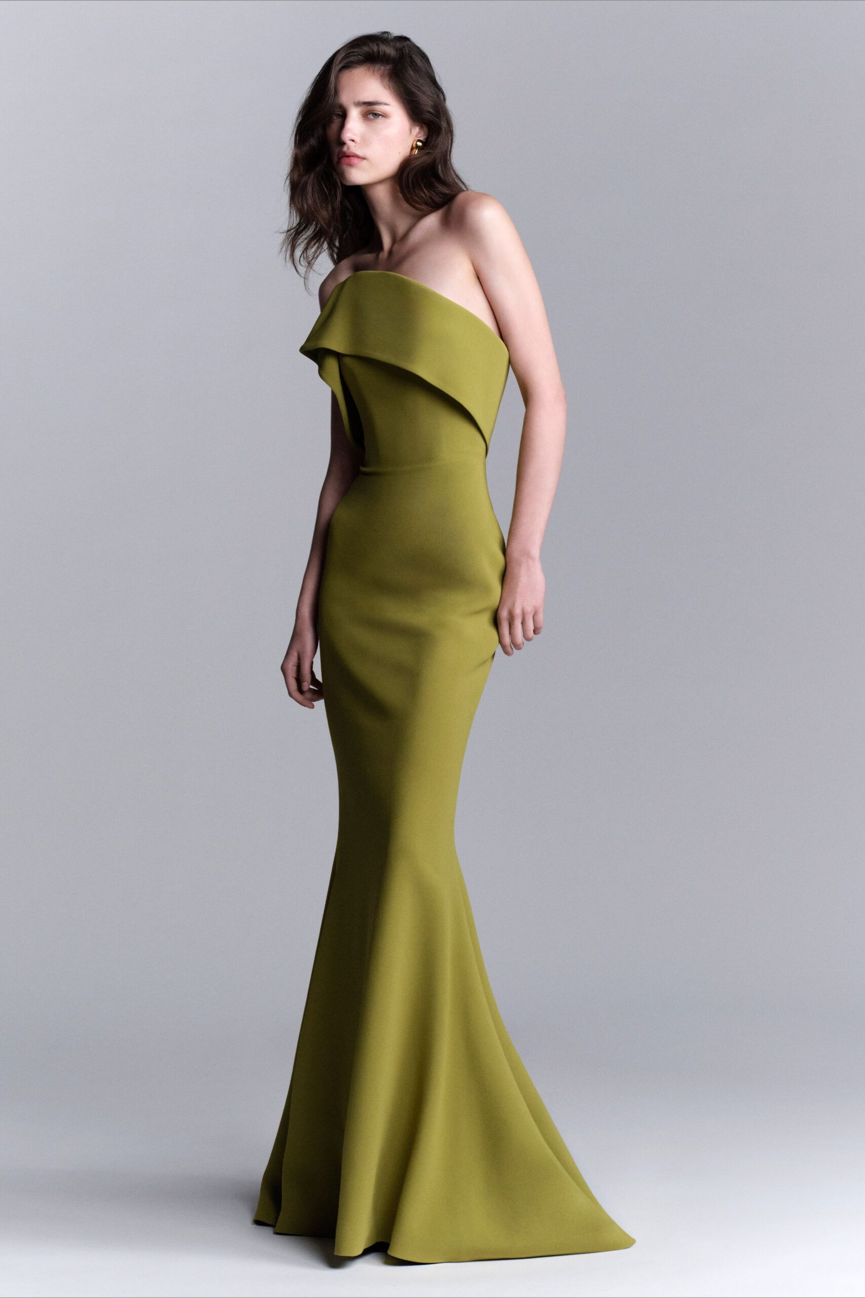 green strapless ruffled gown